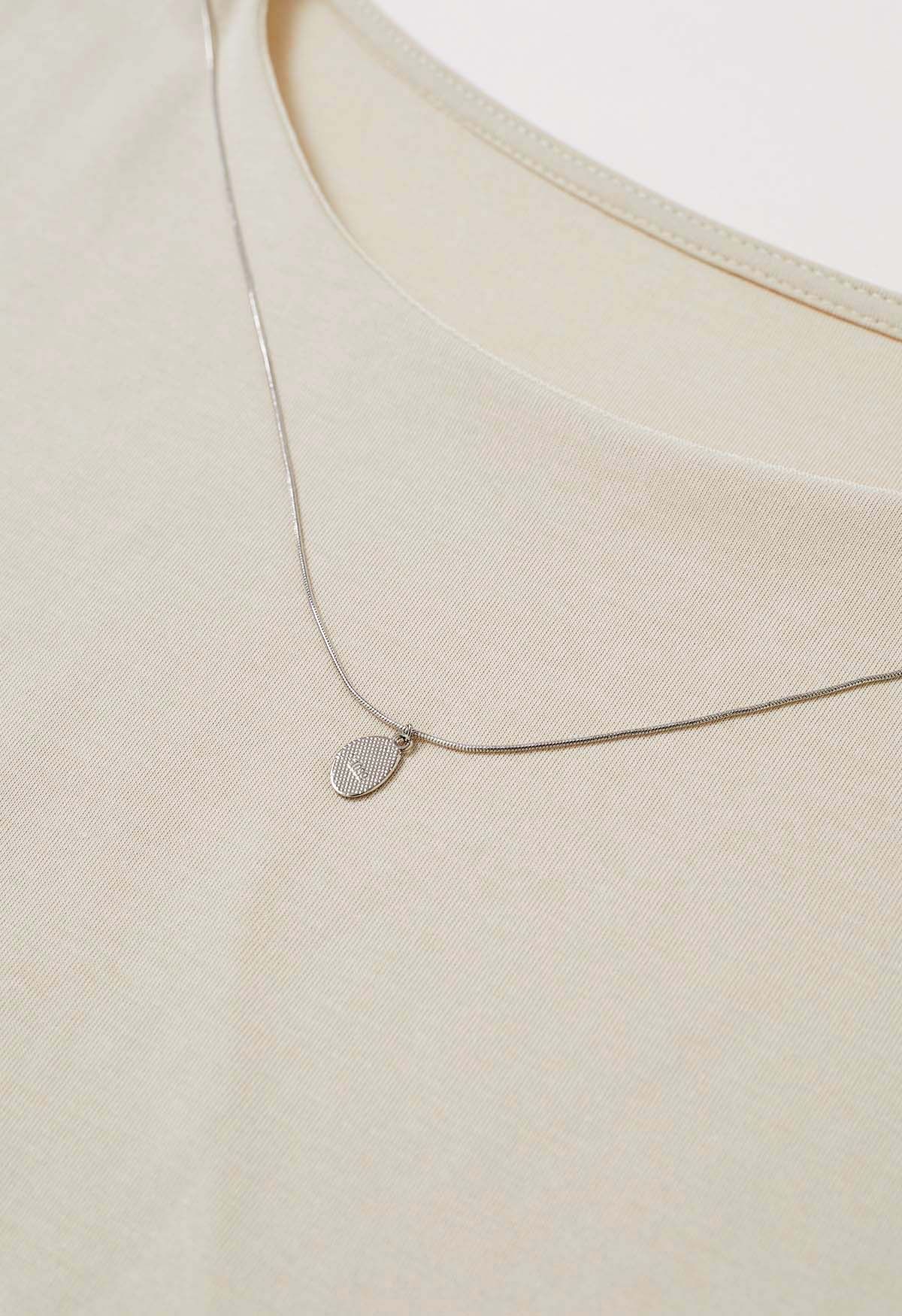 Haut en coton à plis latéraux avec collier décoratif en sable