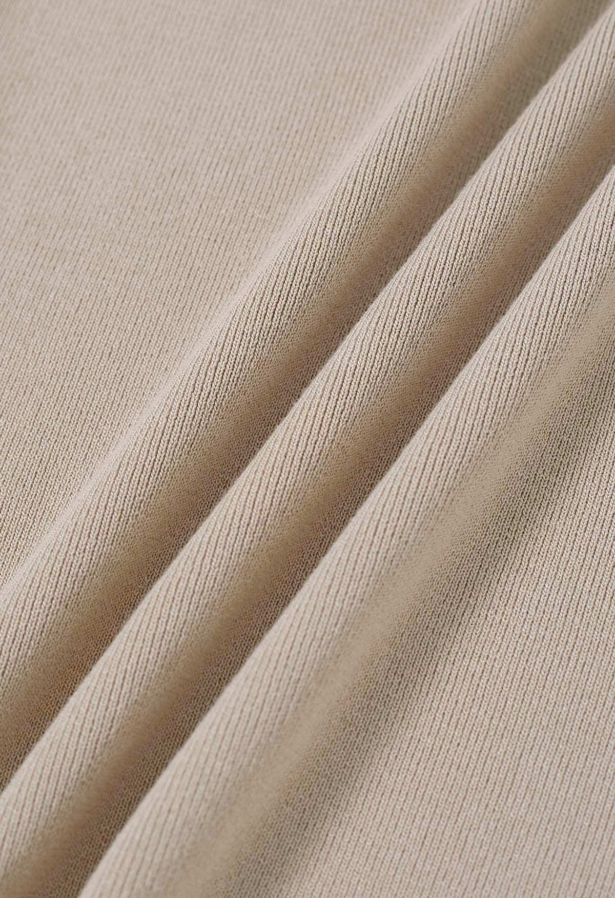 Haut en tricot à une épaule en forme de U à décor métallique en taupe