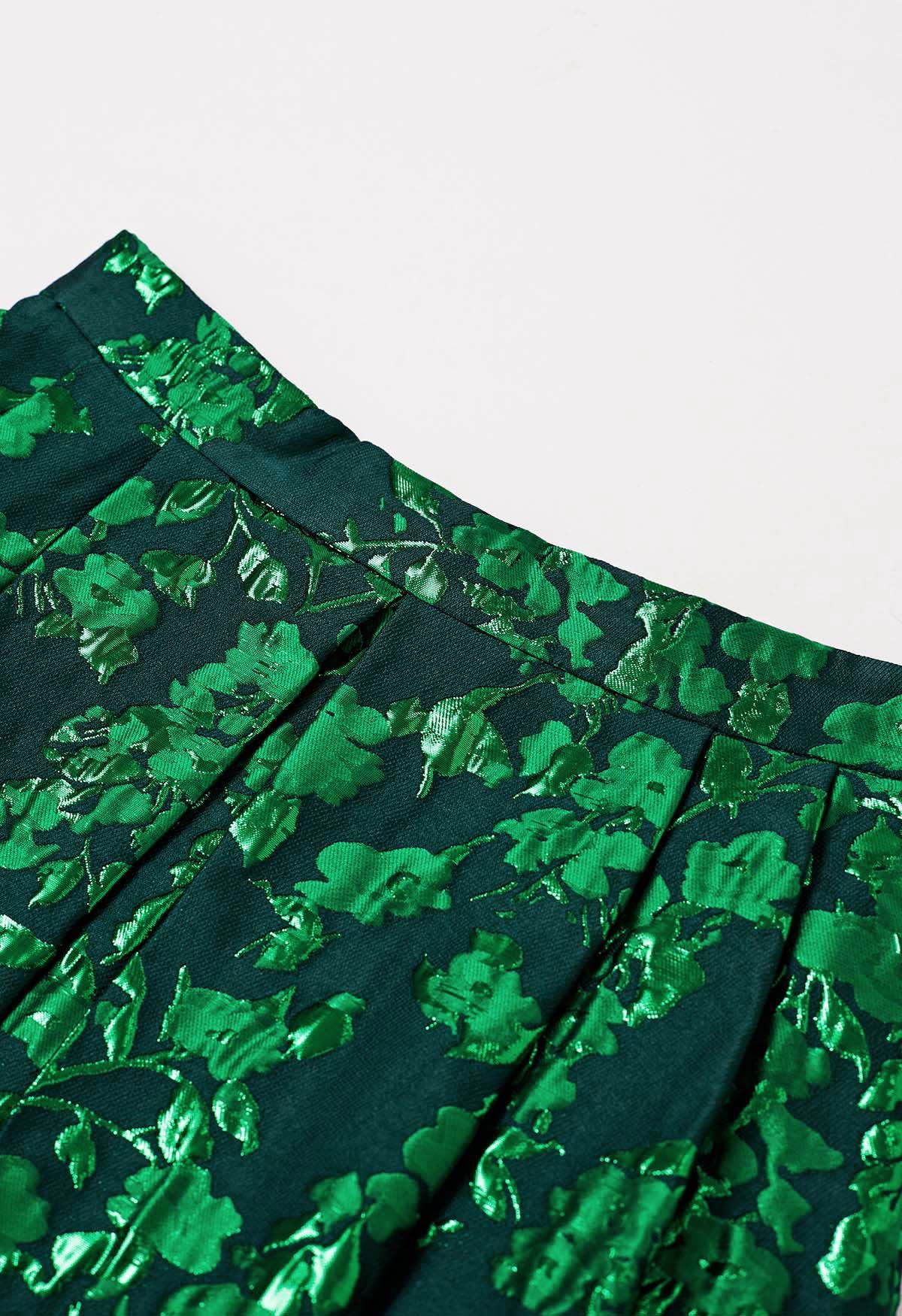 Mini-jupe plissée en jacquard floral vert