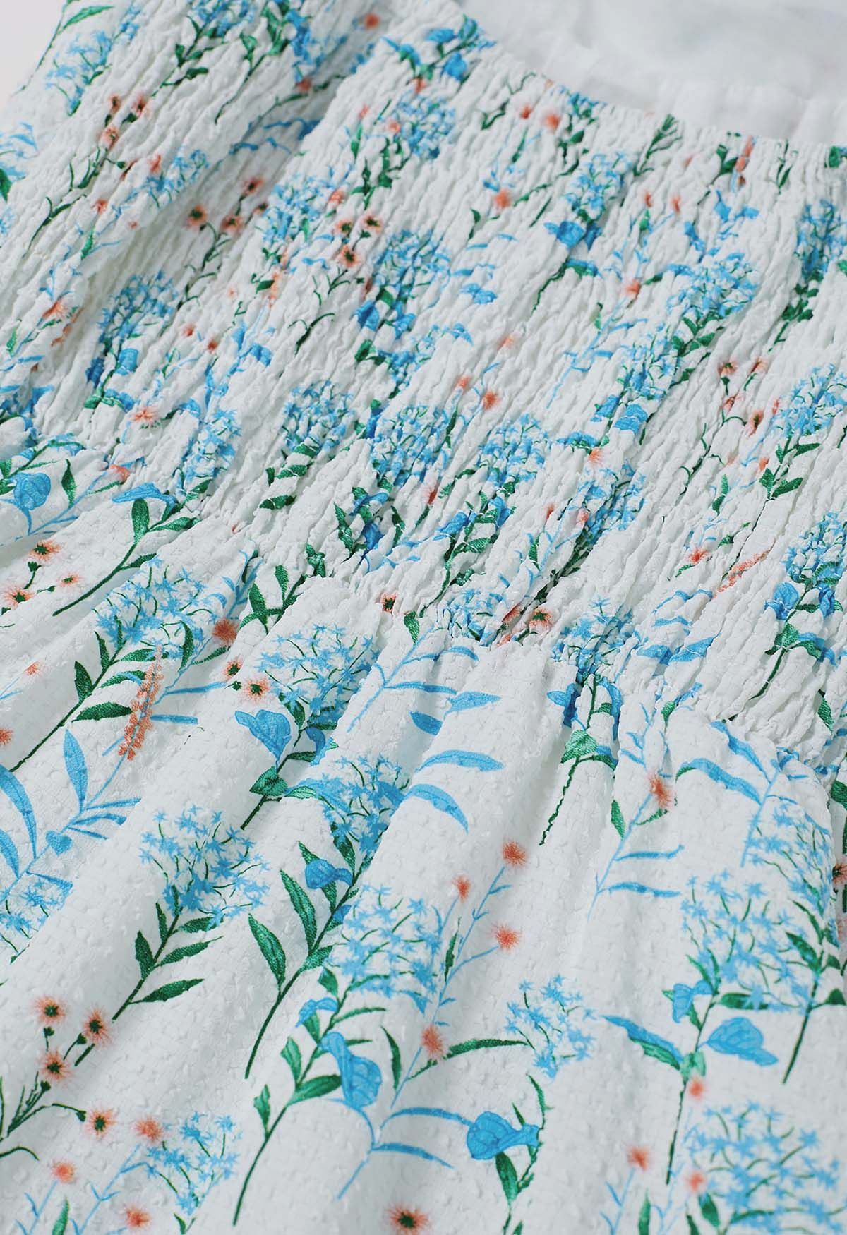 Robe midi bleue en relief à bretelles nouées et imprimé floral