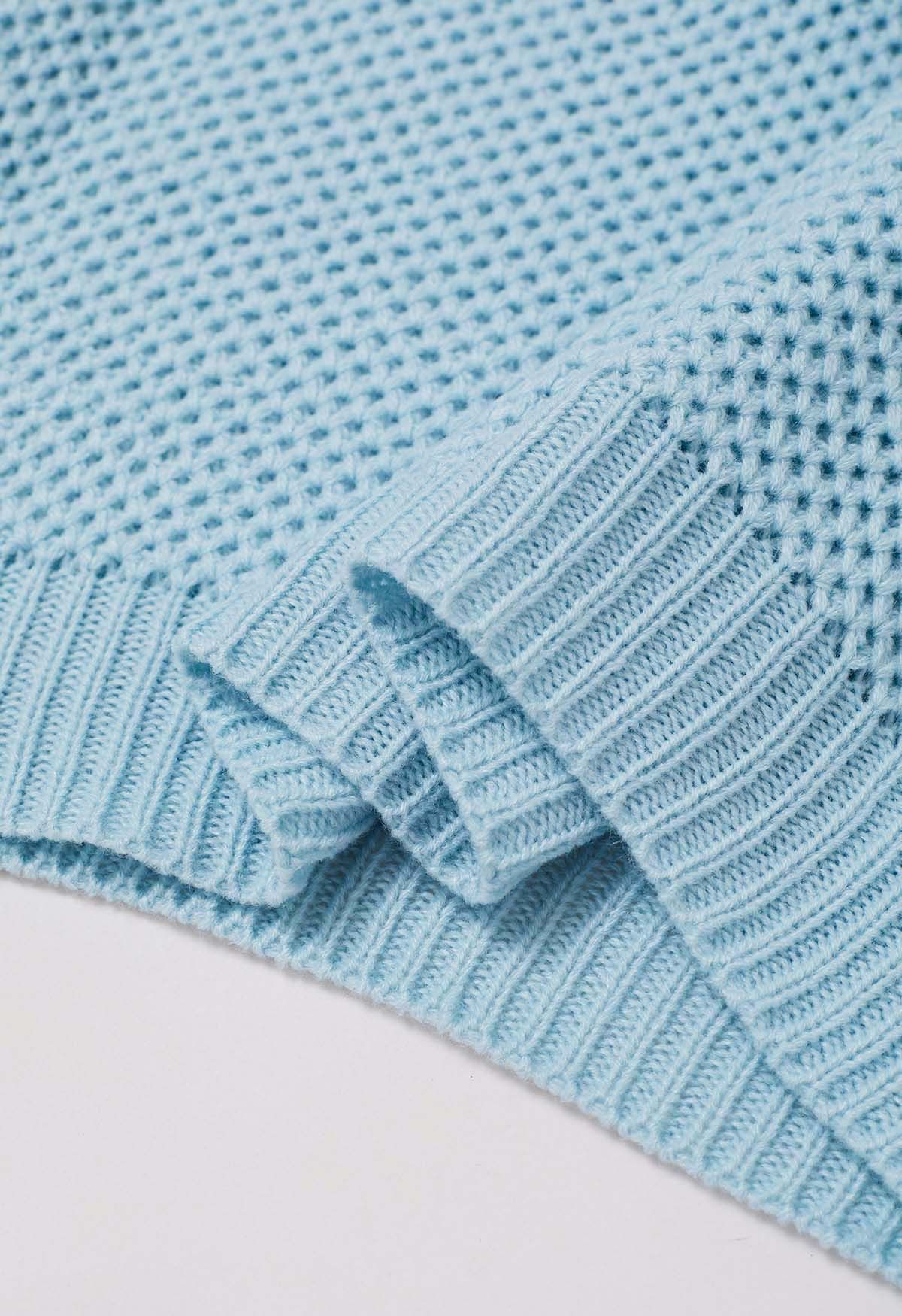 Pull en tricot gaufré boutonné avec poche plaquée en bleu bébé