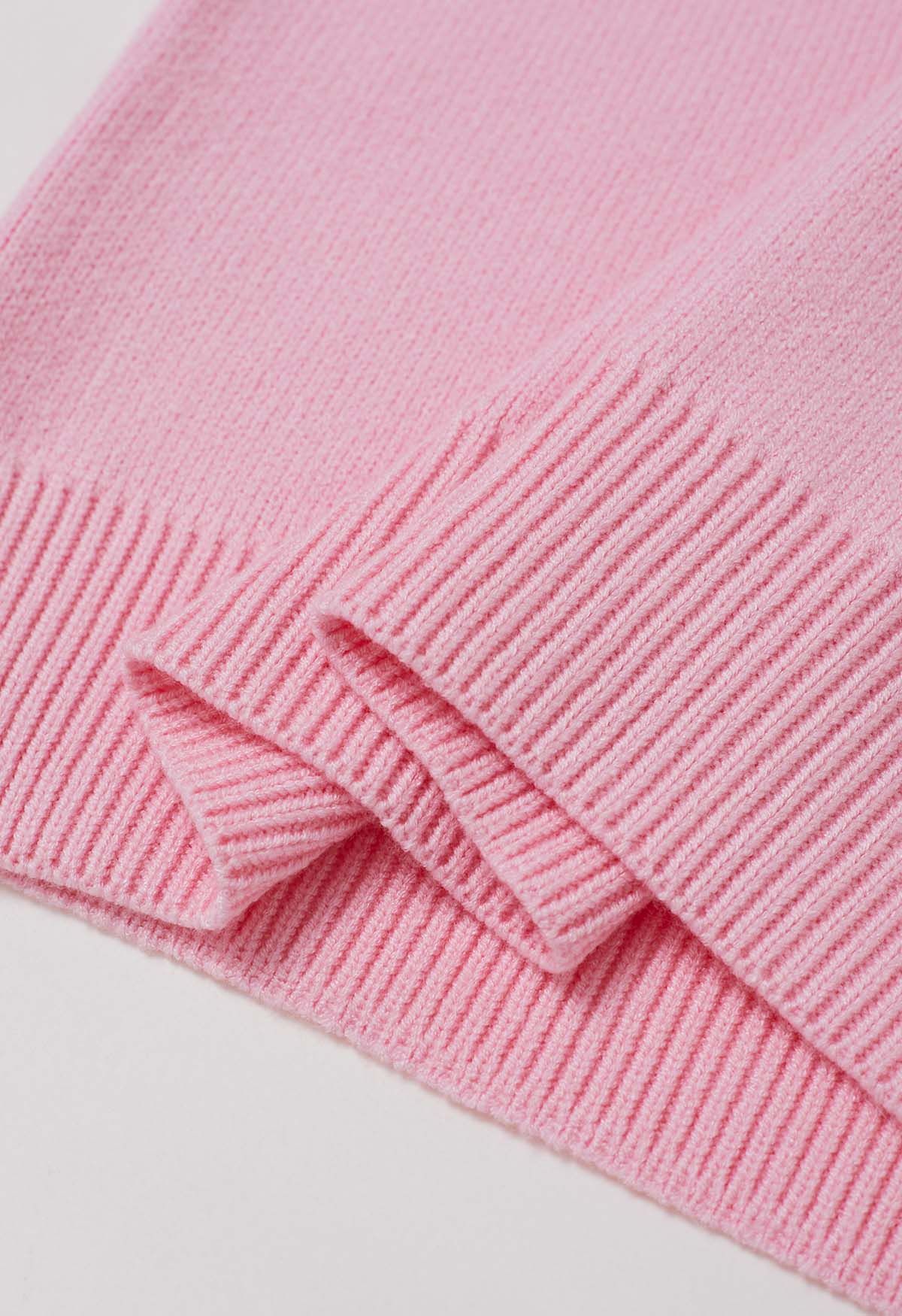 Pull en tricot jacquard à motif ruban et nœud papillon en rose