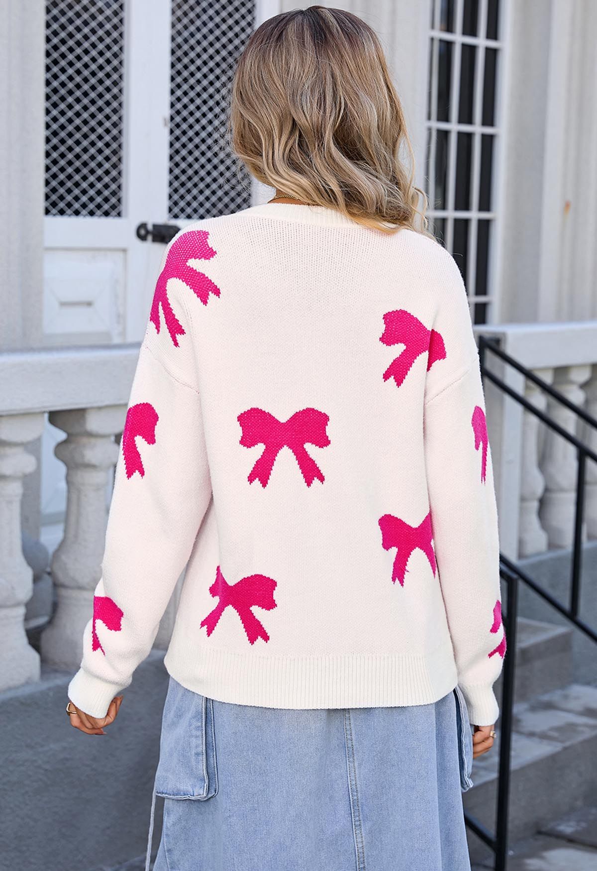 Pull en tricot jacquard rose avec nœud papillon