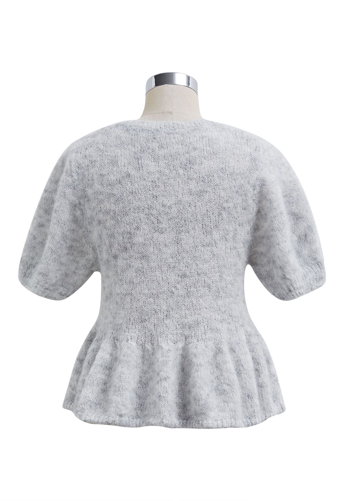 Haut en tricot pelucheux à motif péplum évasé en gris