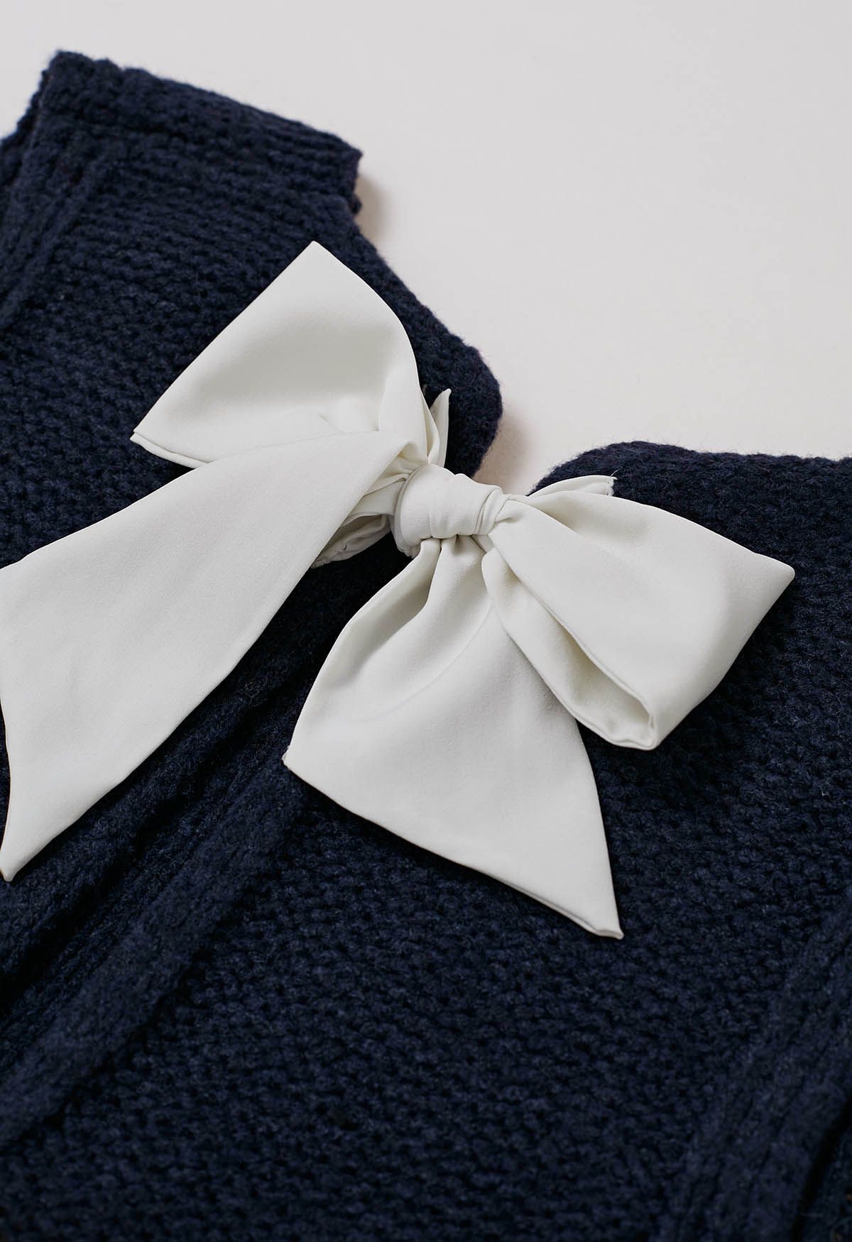 Gilet en tricot avec nœud papillon dans le dos en bleu marine