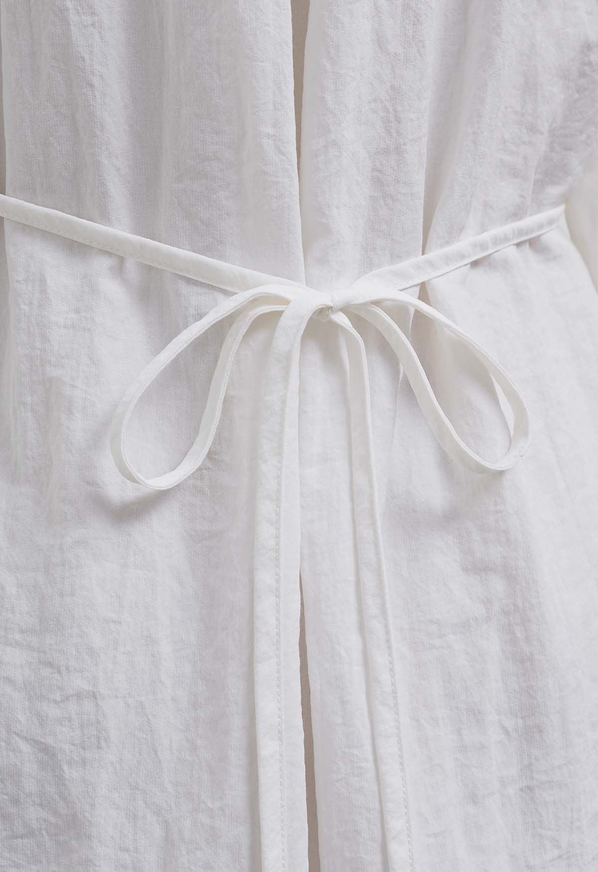 Chemise portefeuille boutonnée à col et plis latéraux en blanc