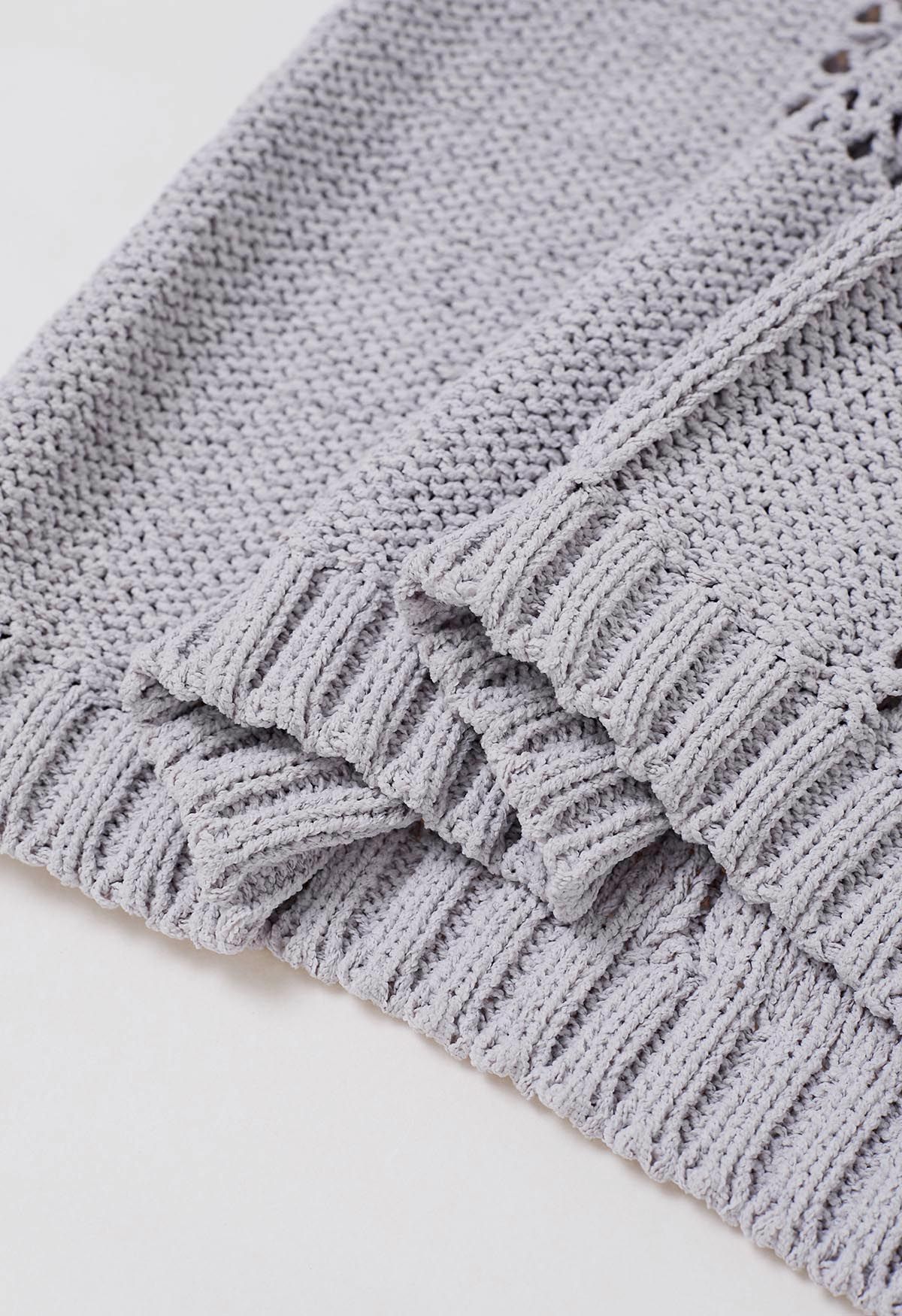 Haut en tricot à col noué et ajouré en gris