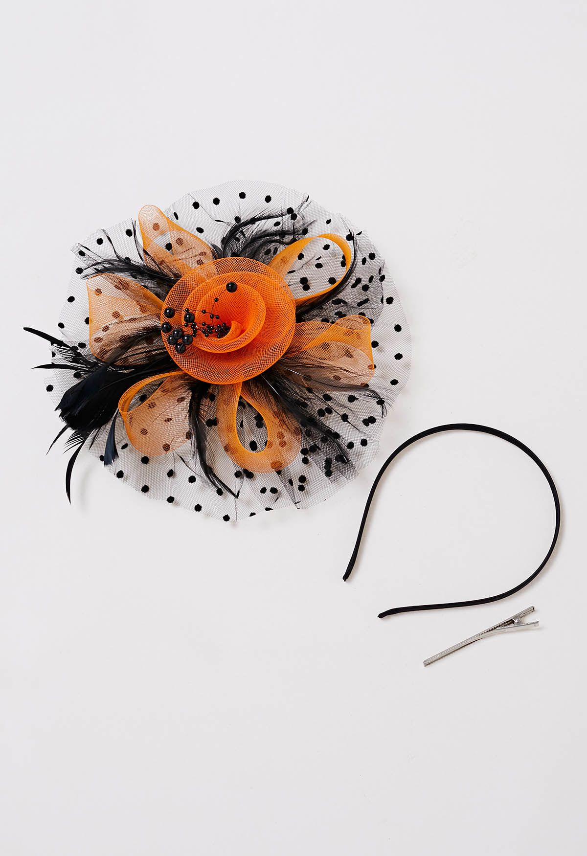 Bandeau en maille à pois avec pince à cheveux en orange