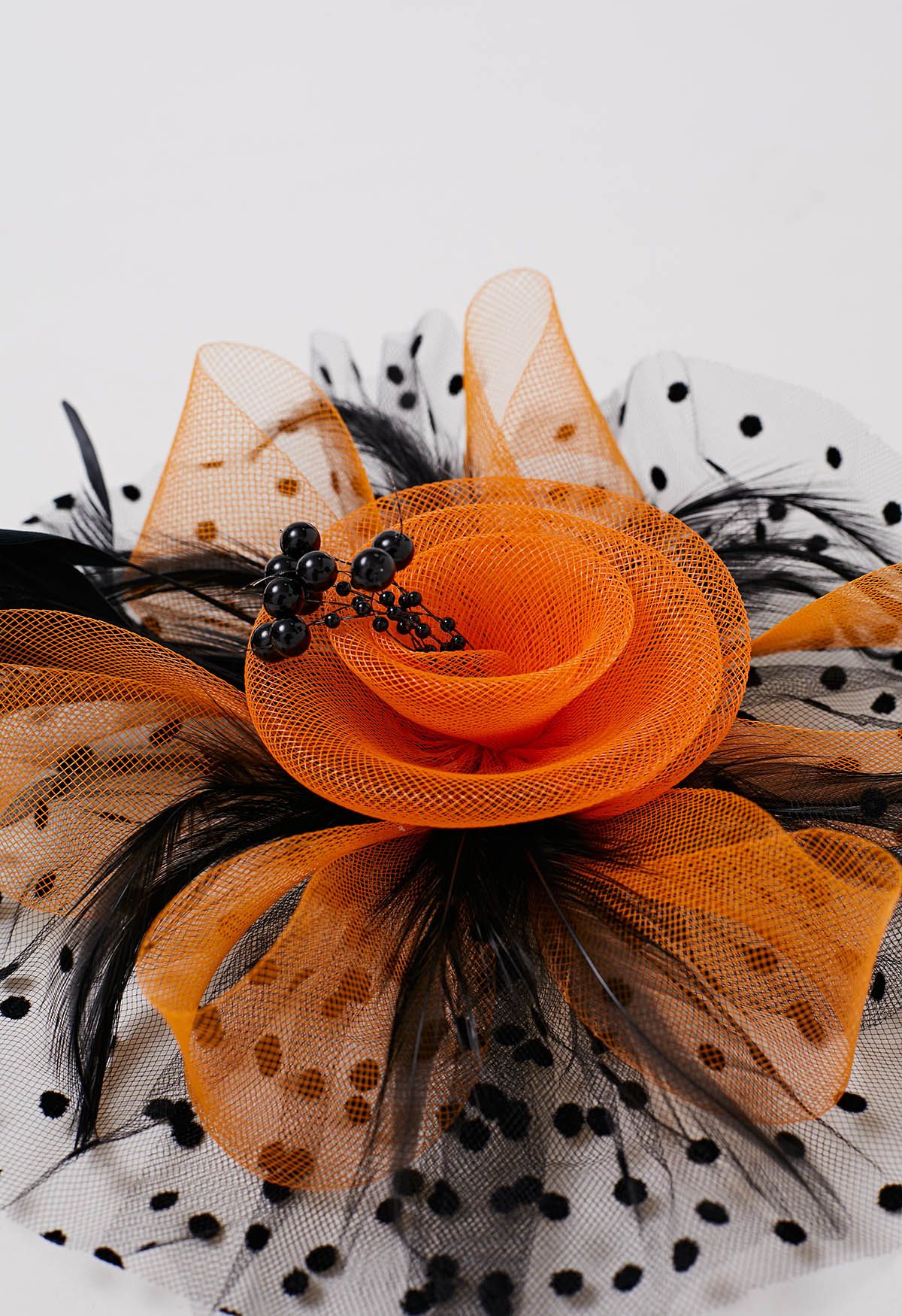 Bandeau en maille à pois avec pince à cheveux en orange