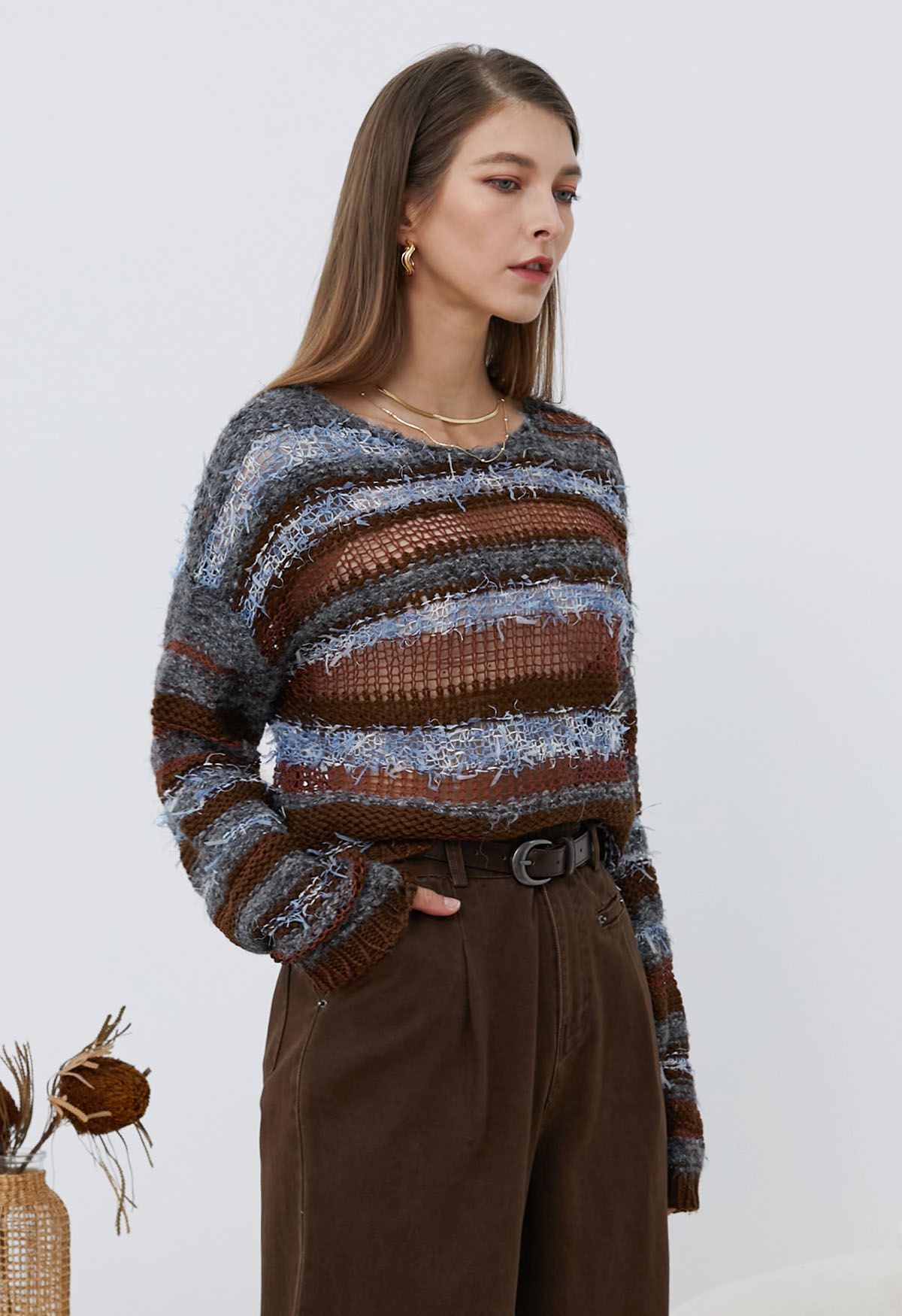 Pull en maille pointelle à rayures multicolores et franges en bordeaux