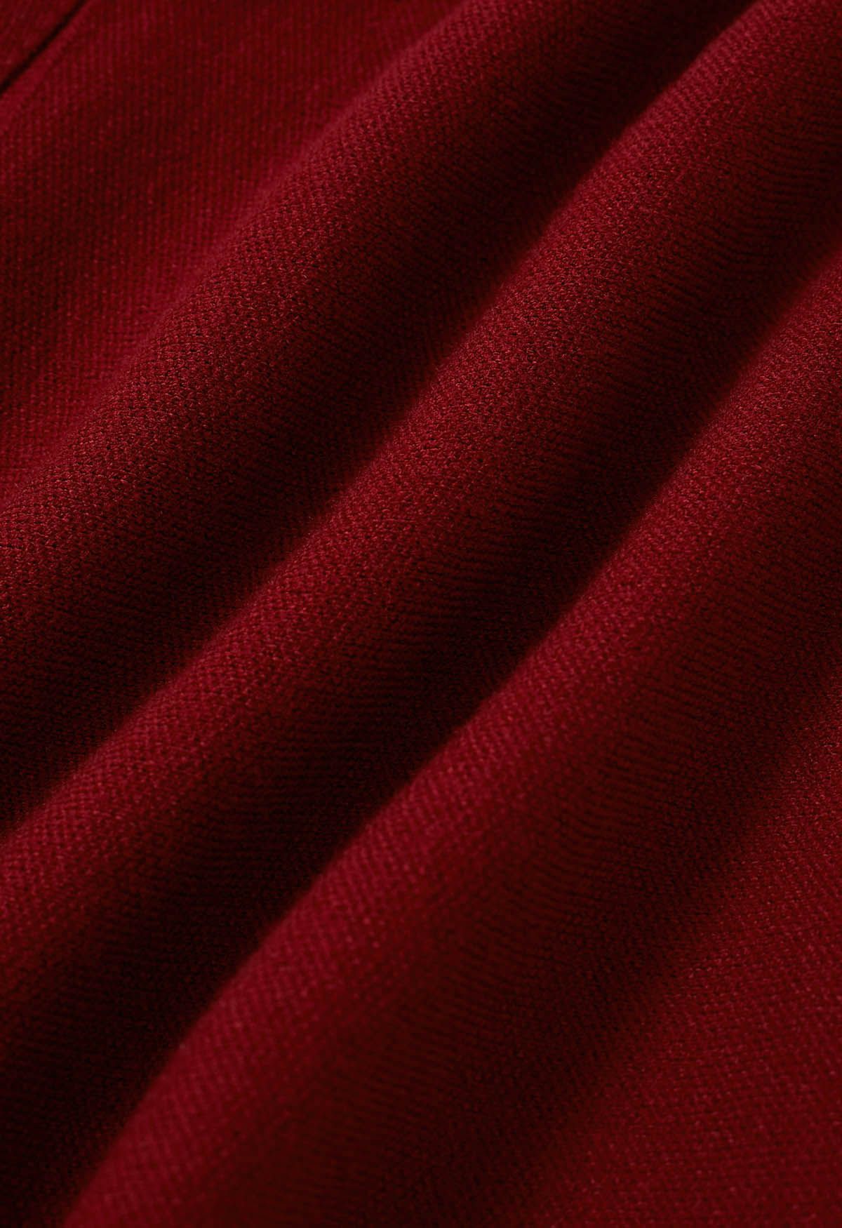 Mini-jupe en tricot à plis latéraux en rouge