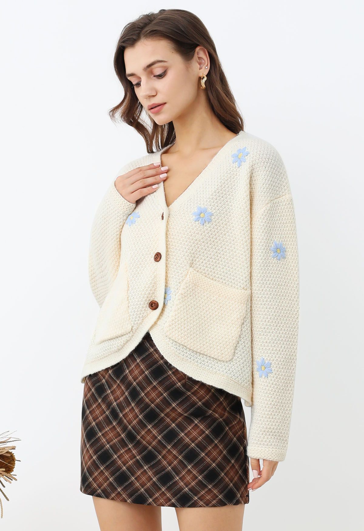 Cardigan en tricot gaufré à motif floral et point attachant en crème