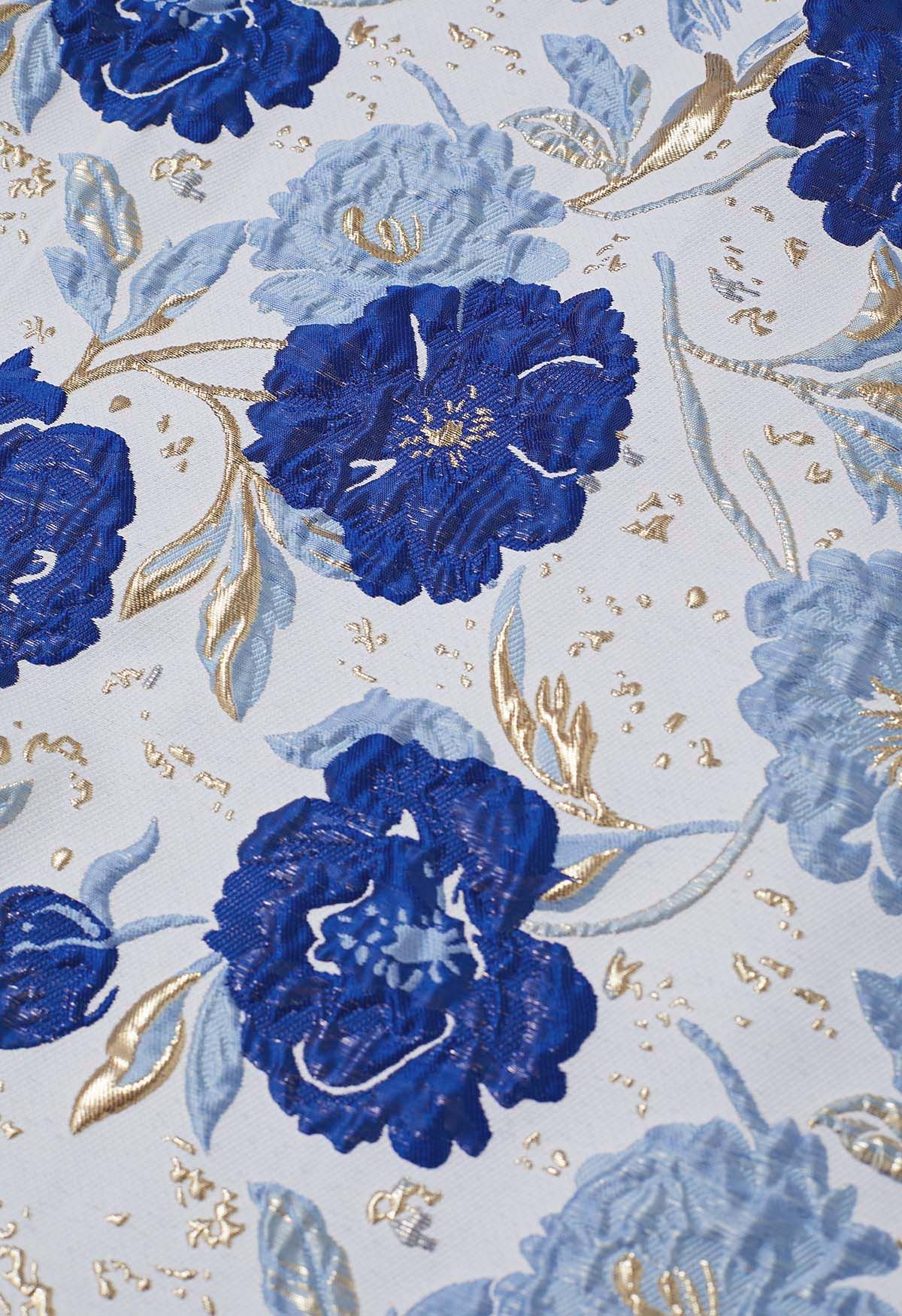 Jupe midi plissée évasée en jacquard fleuri orné de motifs indigo