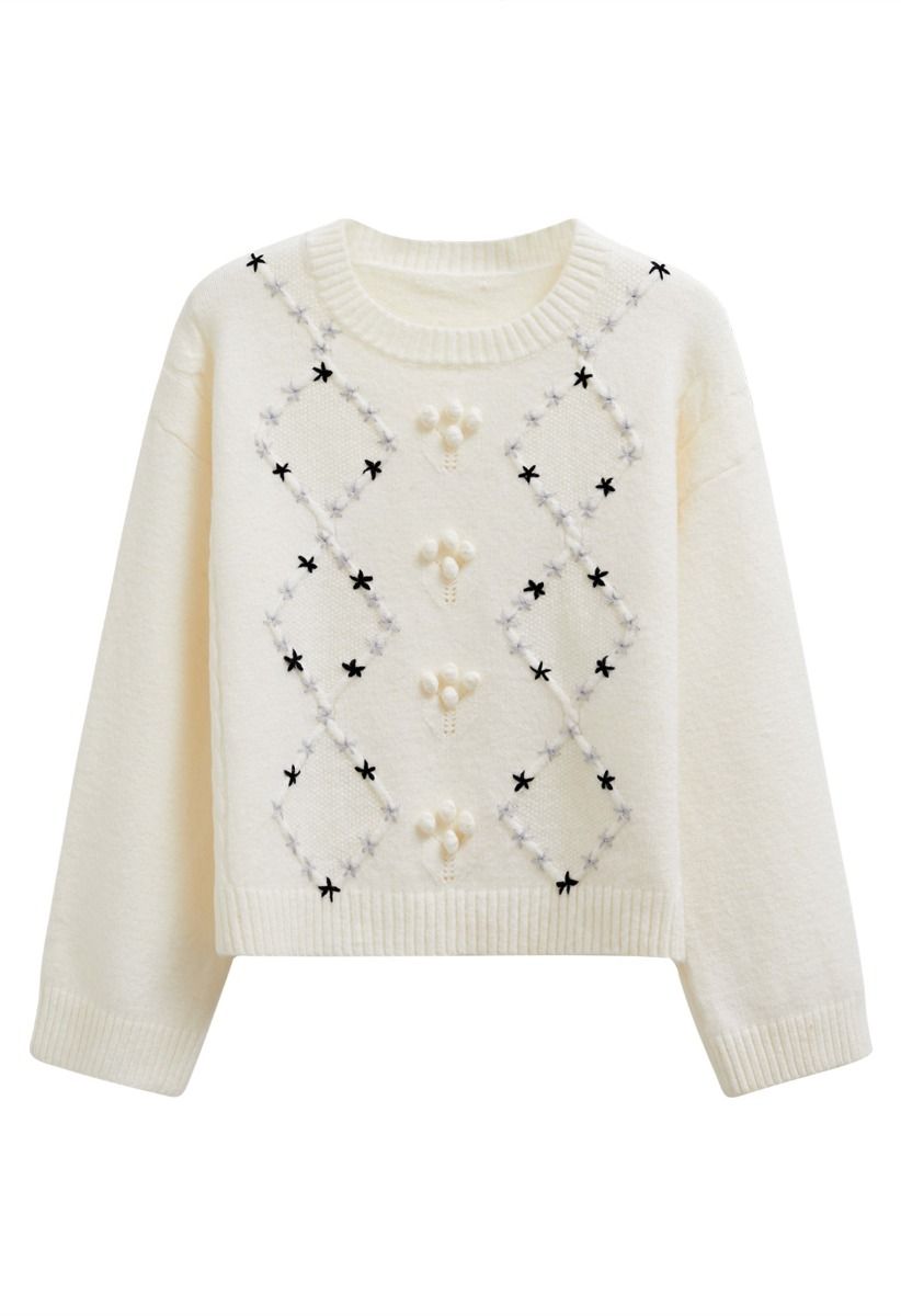 Pull côtelé à pompons et à motifs floraux en losanges, couleur crème