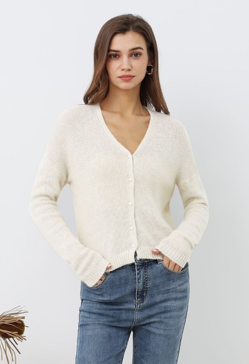 Cardigan en tricot à boutons nacrés de couleur unie en crème