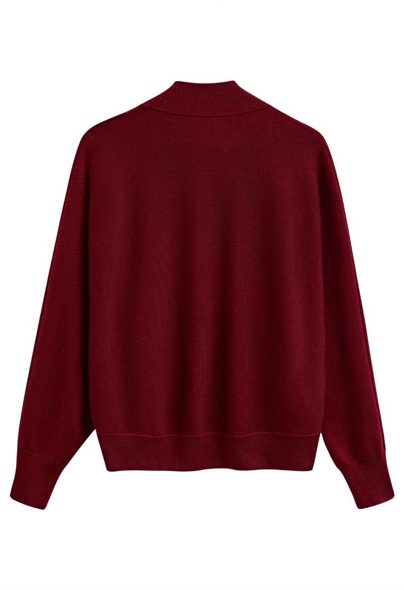 Cardigan minimaliste en tricot côtelé ouvert sur le devant en rouge