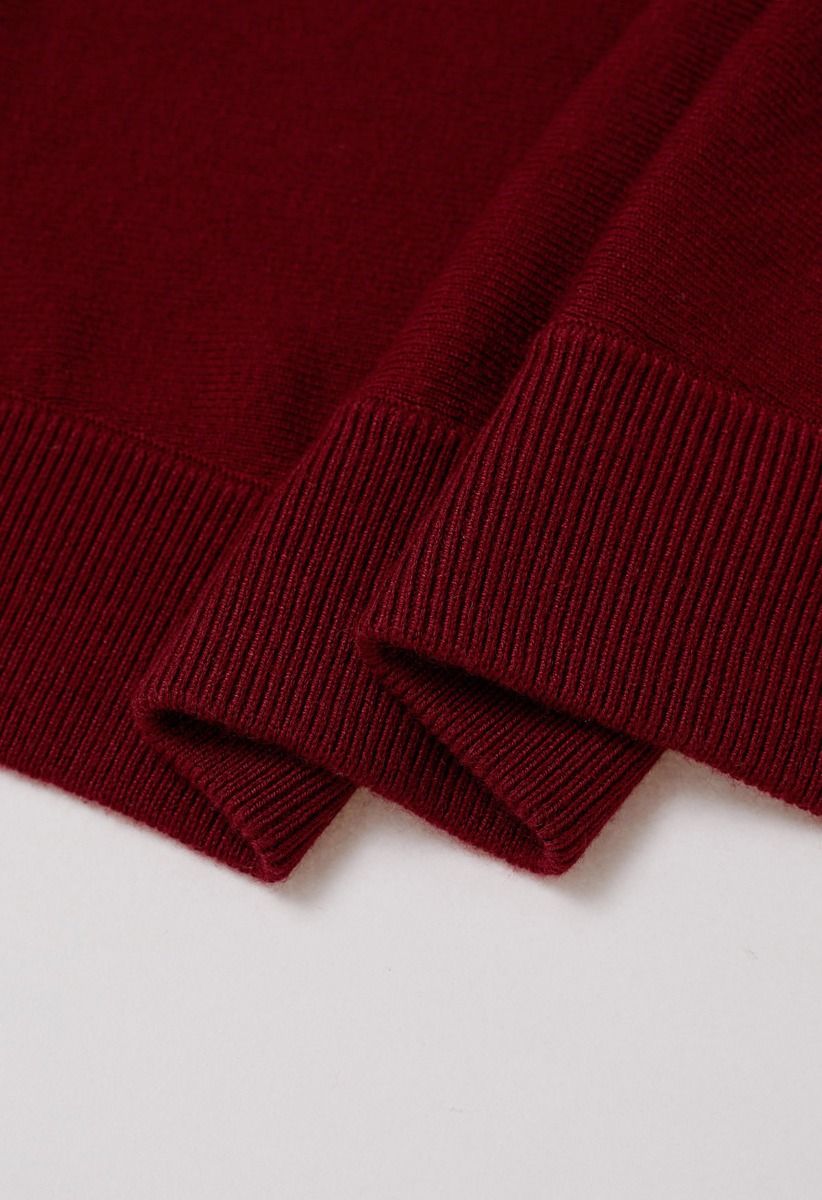 Cardigan minimaliste en tricot côtelé ouvert sur le devant en rouge