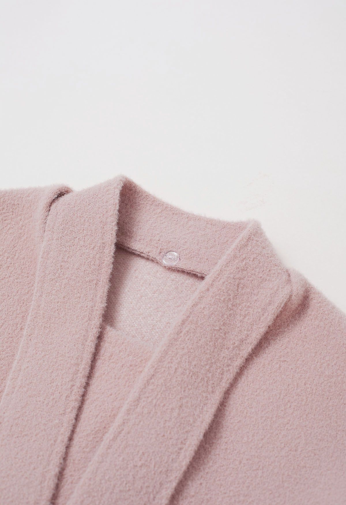 Manteau en tricot à boutons dorés amovibles et col noué en rose