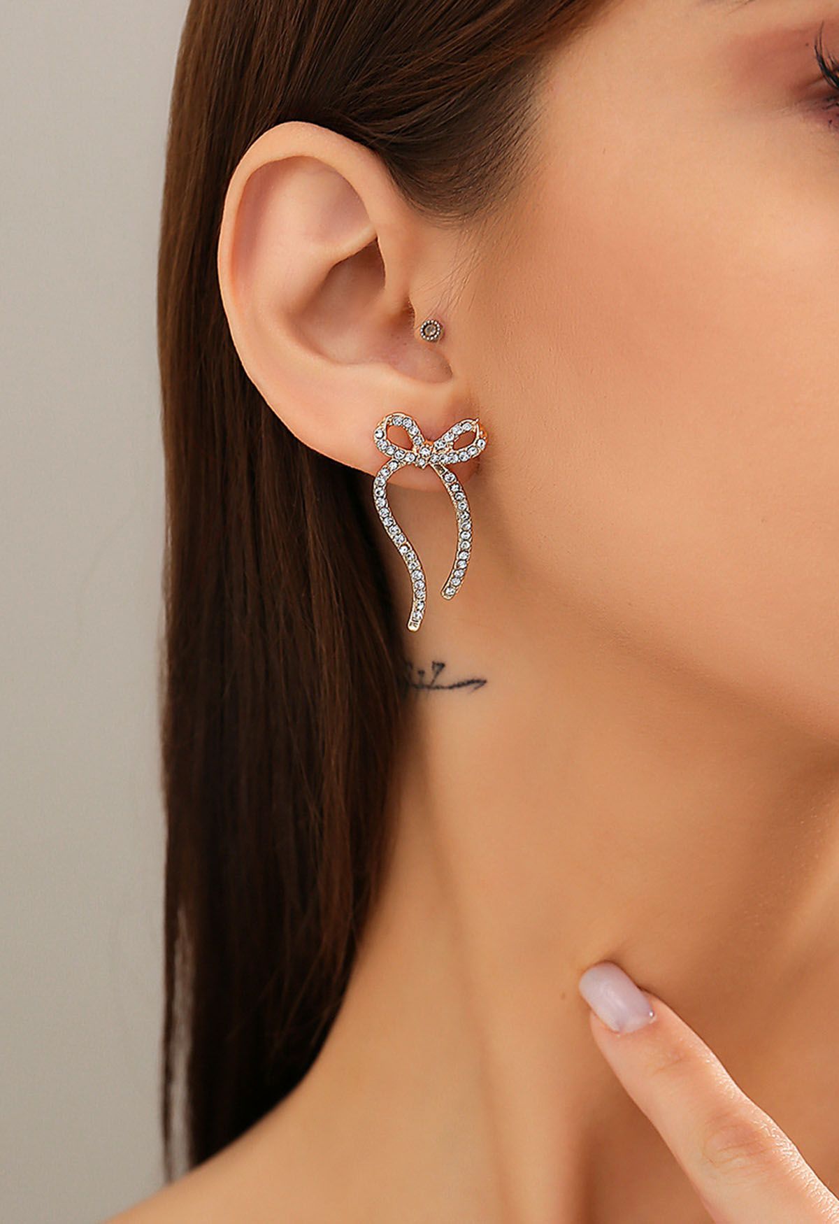 Boucles d'oreilles en forme de nœud avec strass en or