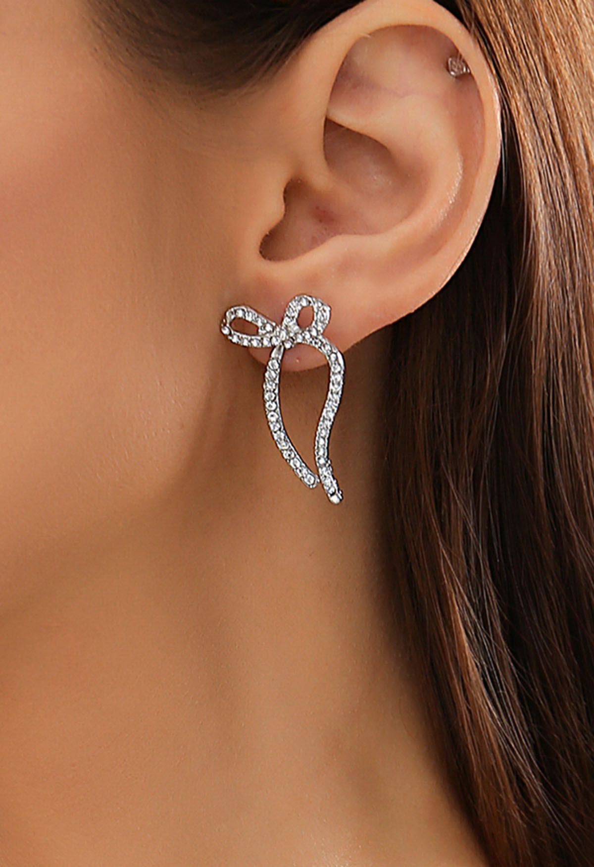 Boucles d'oreilles en forme de nœud avec strass en argent