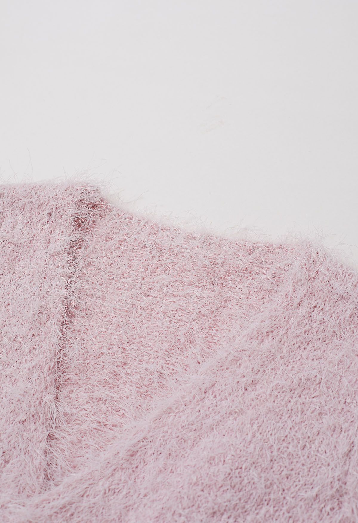 Haut en tricot pelucheux à col en V et taille nouée en rose clair