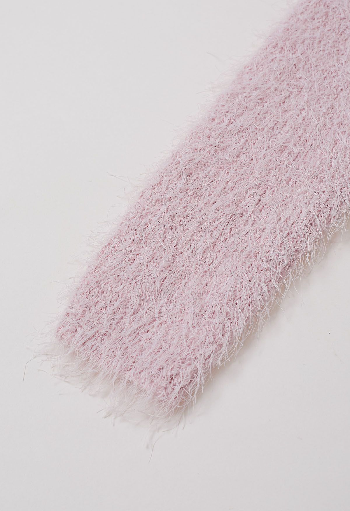 Haut en tricot pelucheux à col en V et taille nouée en rose clair