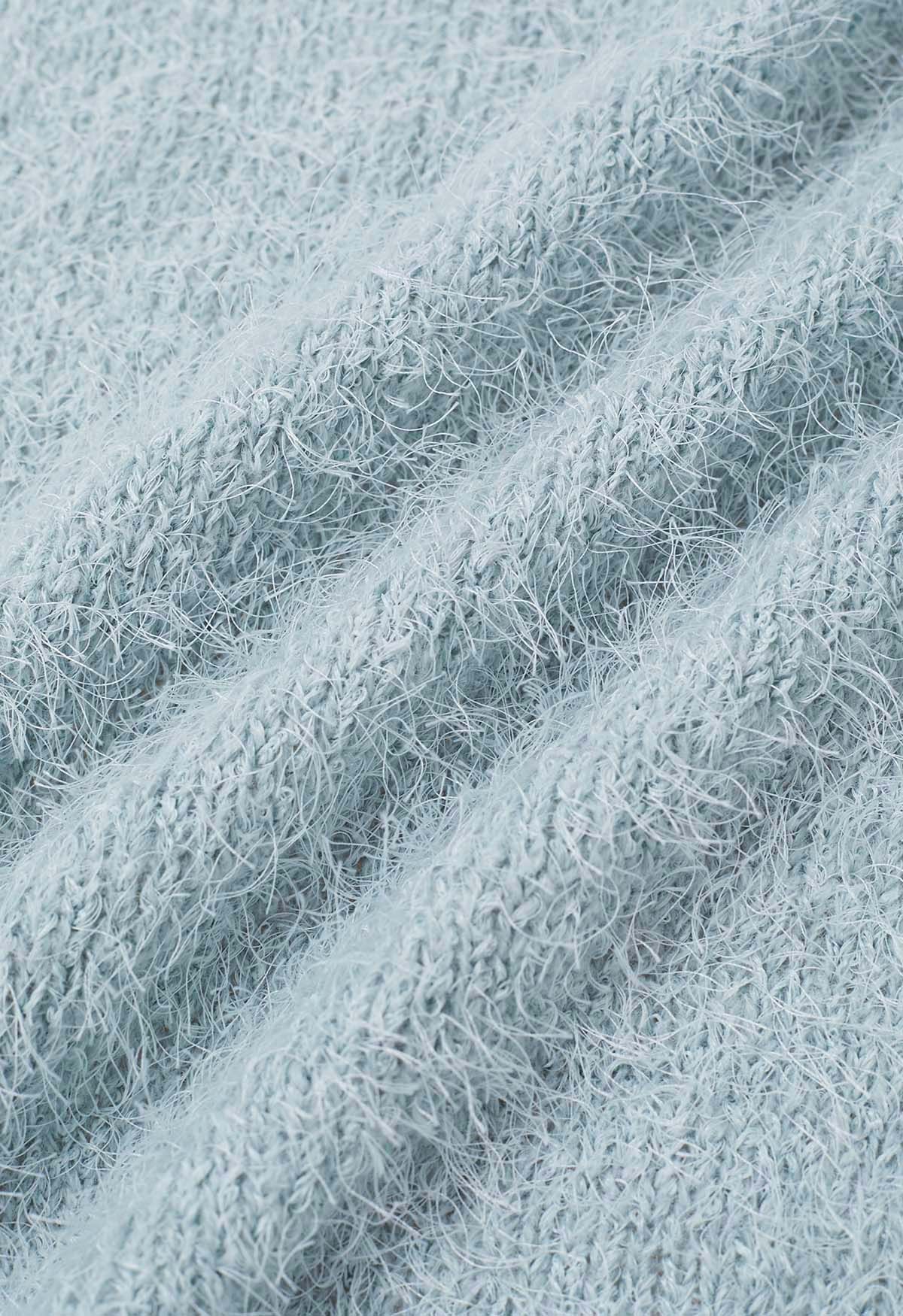 Haut en tricot pelucheux à col en V et taille nouée en bleu clair