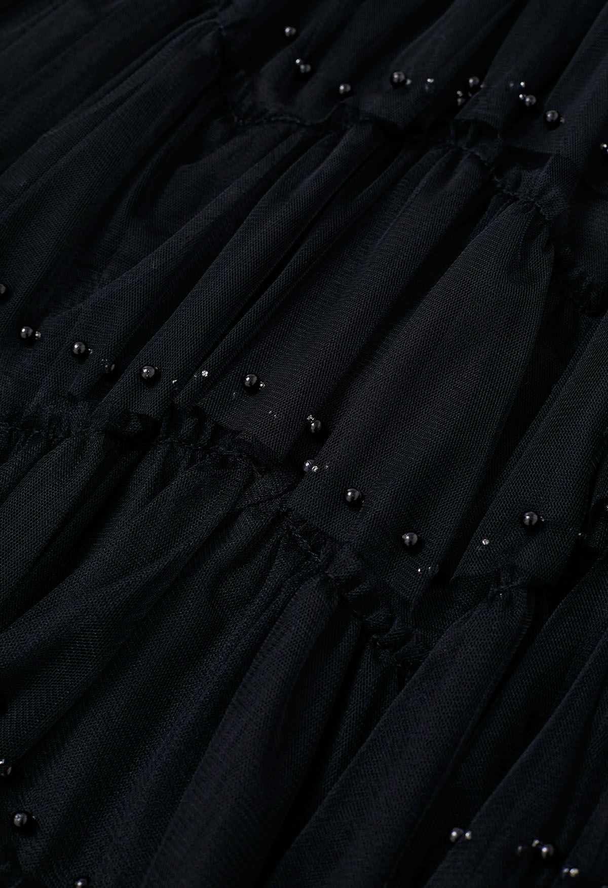 Jupe longue éthérée en tulle perlé noir