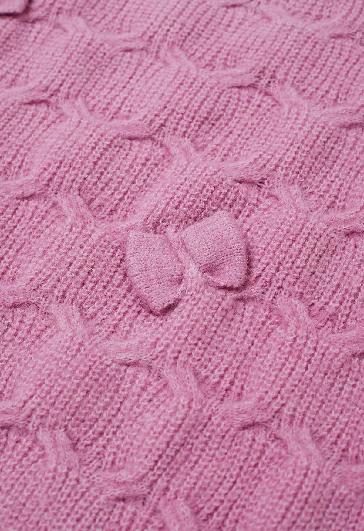 Pull en tricot texturé géométrique à nœud ludique en rose