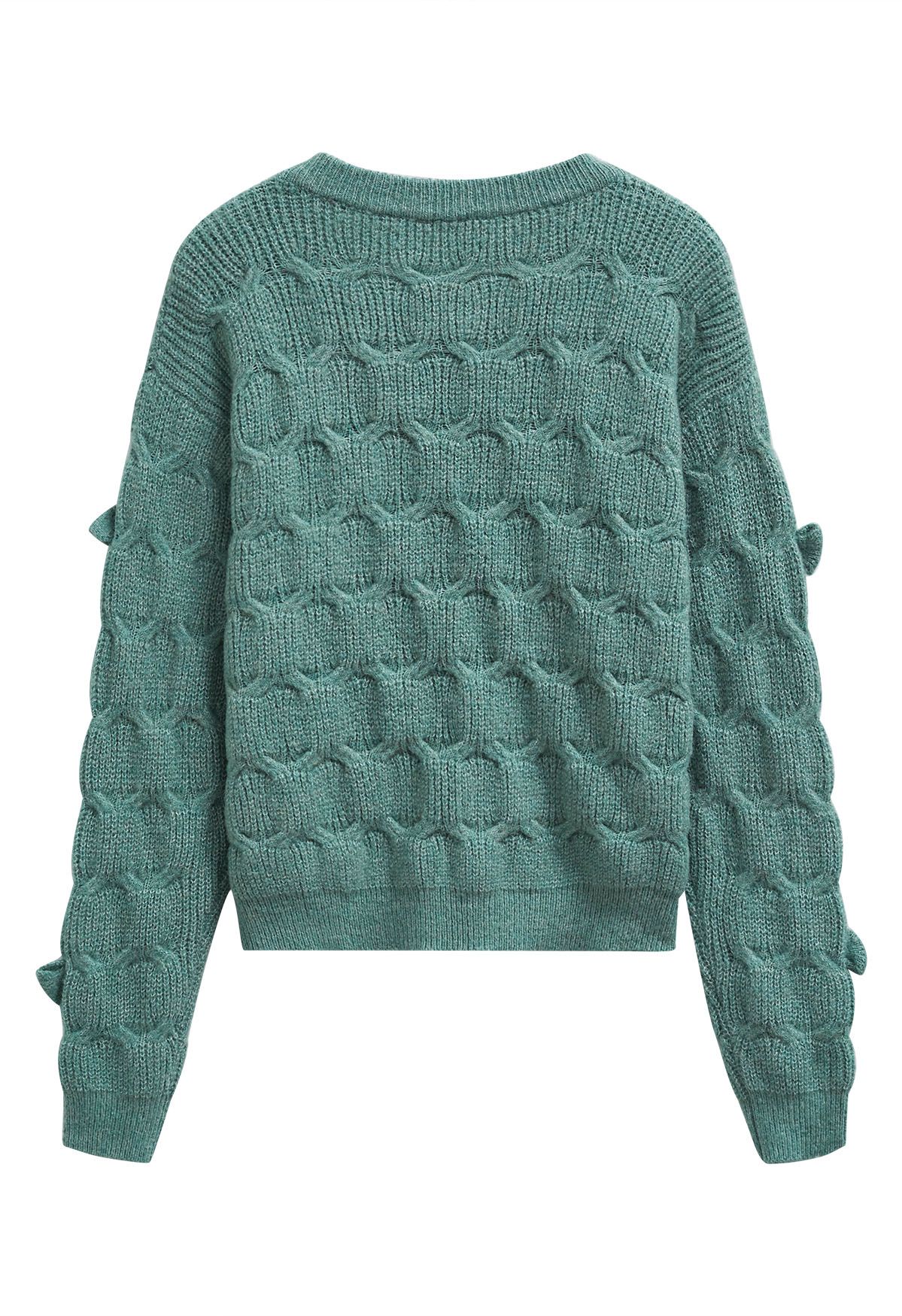 Pull en tricot texturé géométrique à nœud ludique en vert