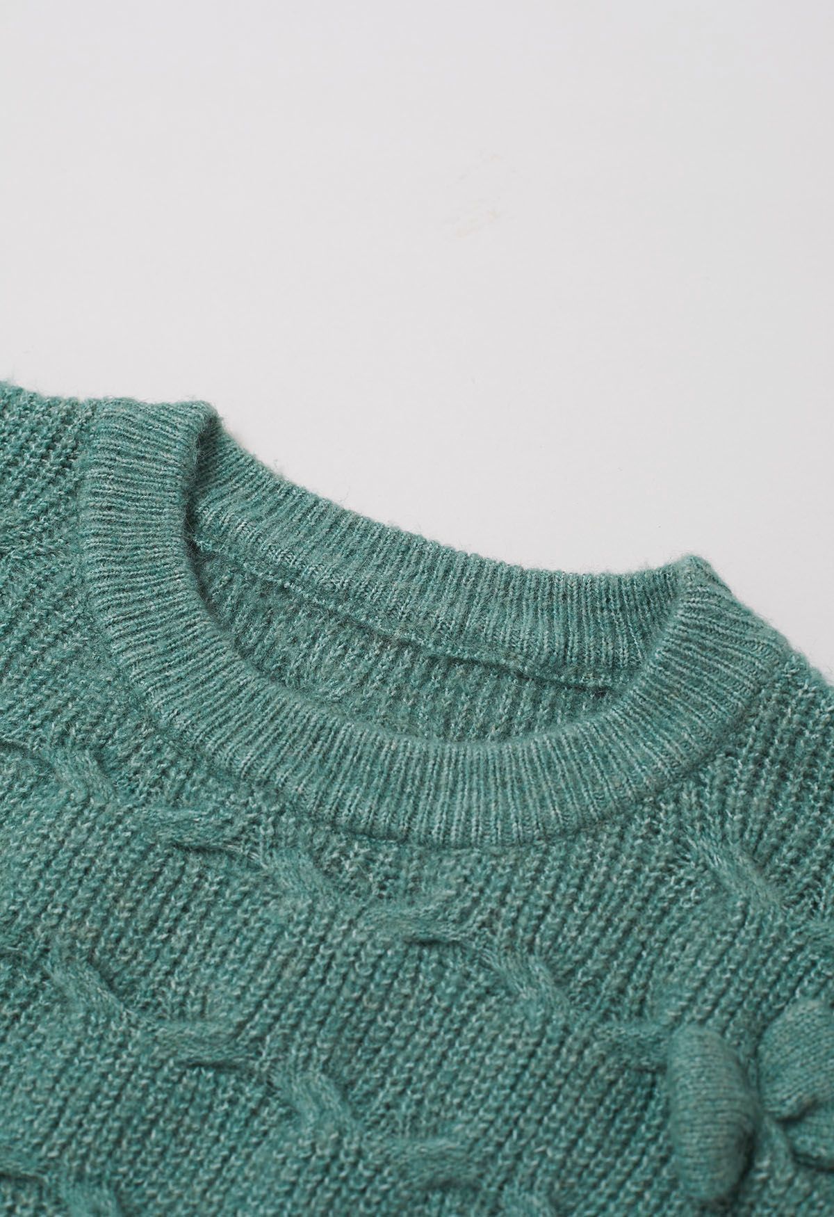 Pull en tricot texturé géométrique à nœud ludique en vert