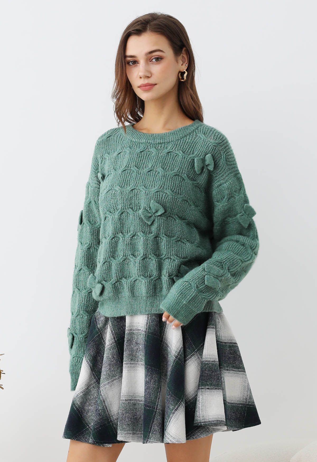 Pull en tricot texturé géométrique à nœud ludique en vert