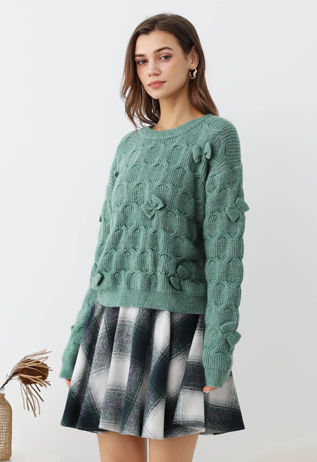 Pull en tricot texturé géométrique à nœud ludique en vert