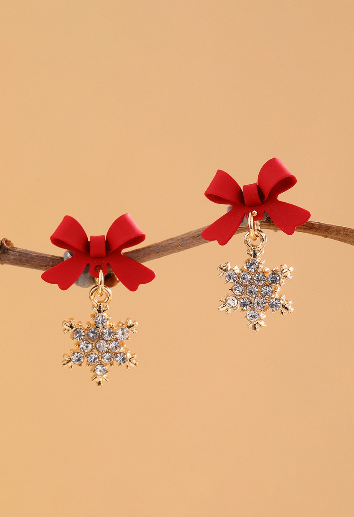 Boucles d'oreilles festives en forme de flocon de neige et de nœud papillon