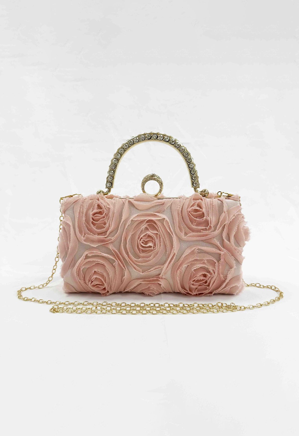 Pochette opulente avec poignée en strass en rose