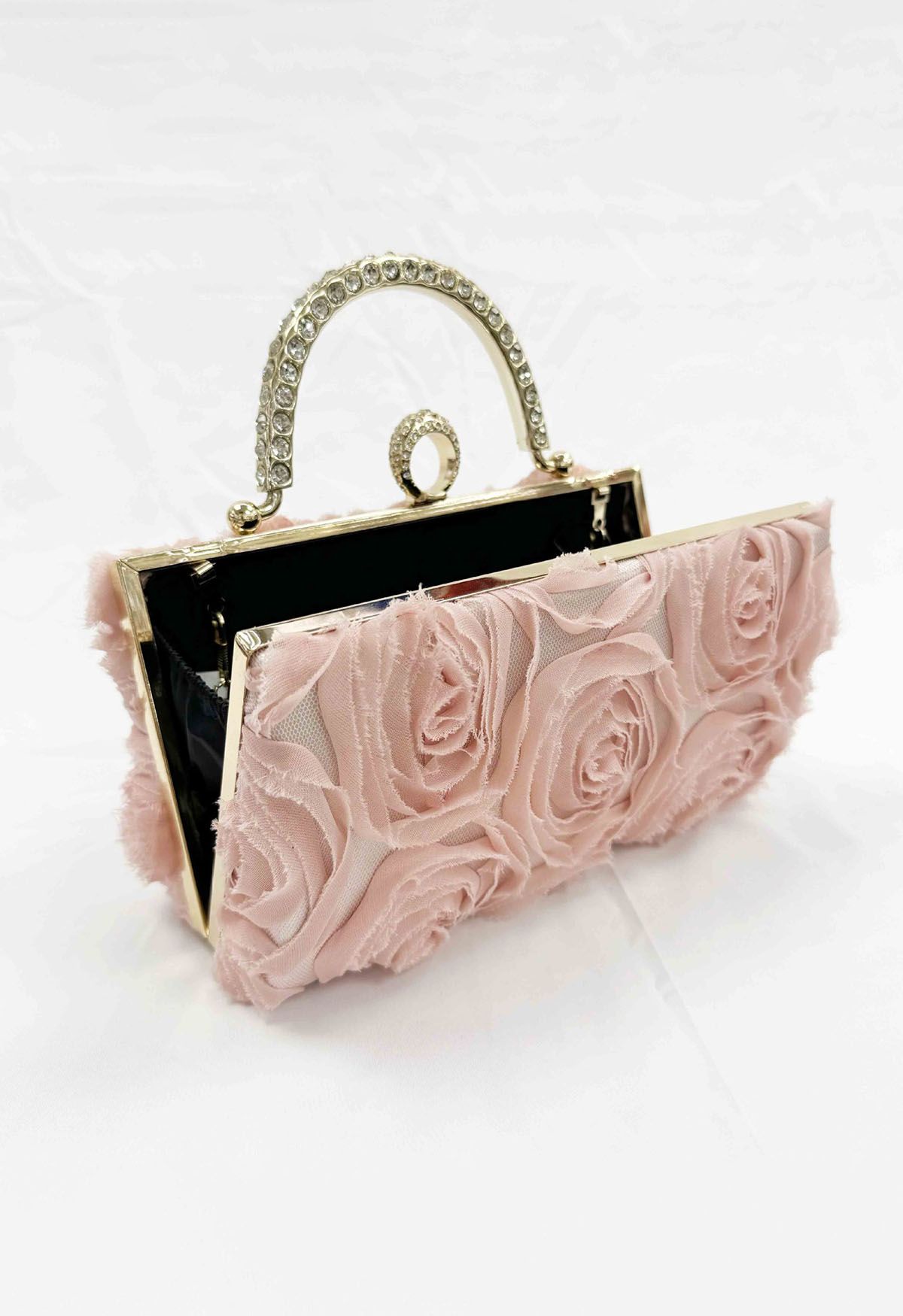 Pochette opulente avec poignée en strass en rose