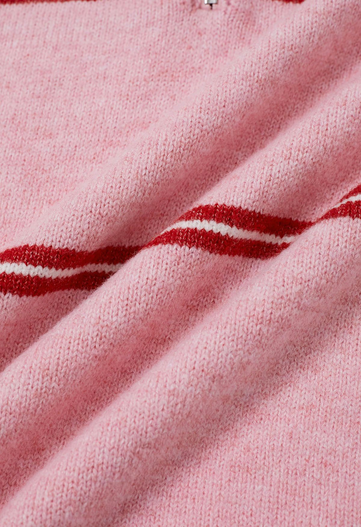 Pull en tricot à rayures sportives et col zippé en rose