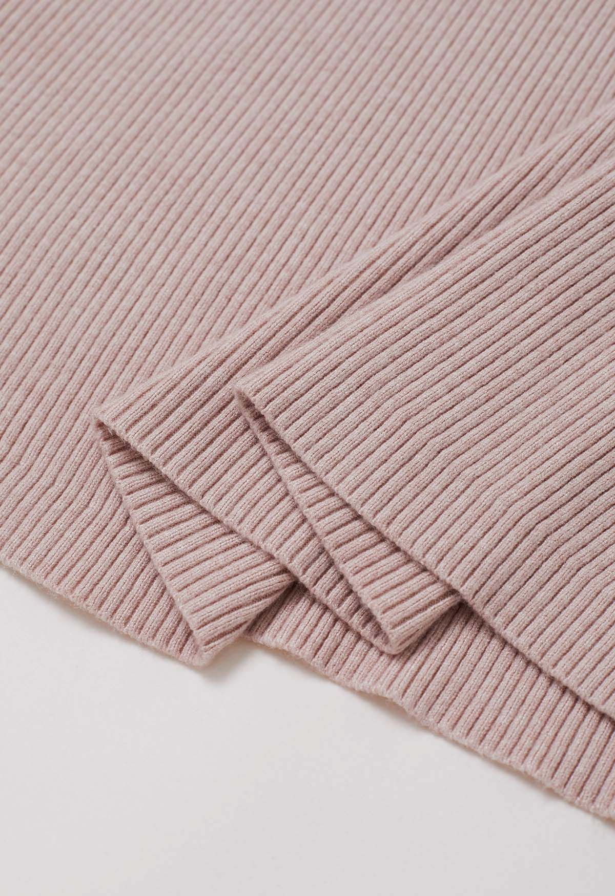 Robe mi-longue en tricot à découpes et devant croisé en rose