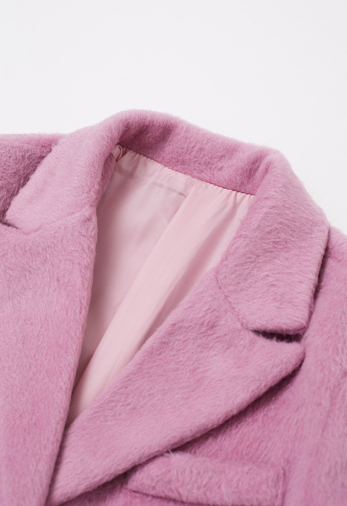 Manteau blazer boutonné en fausse fourrure à revers pointus en rose bonbon