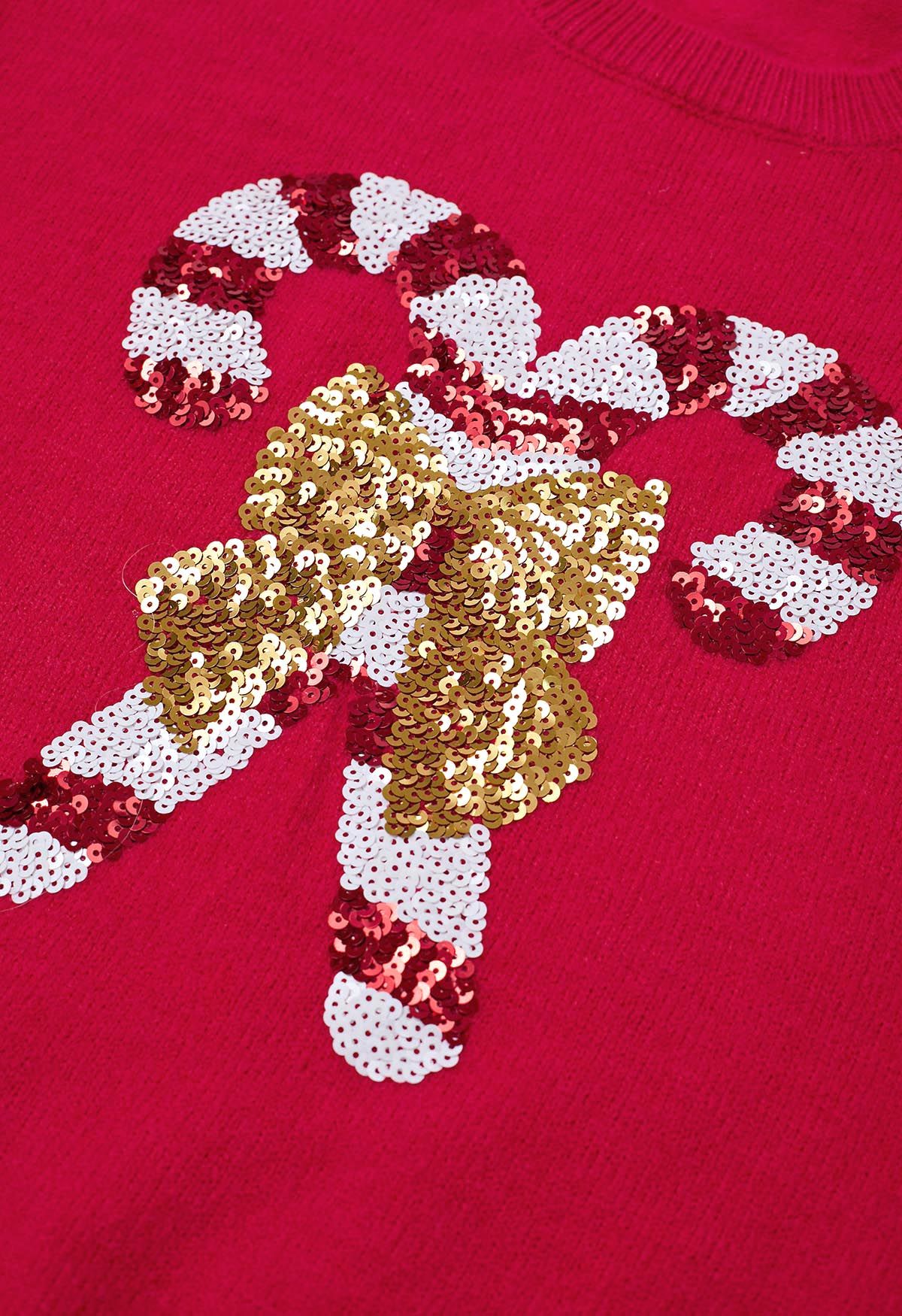 Pull en tricot à paillettes et nœud papillon en sucre d'orge en rouge