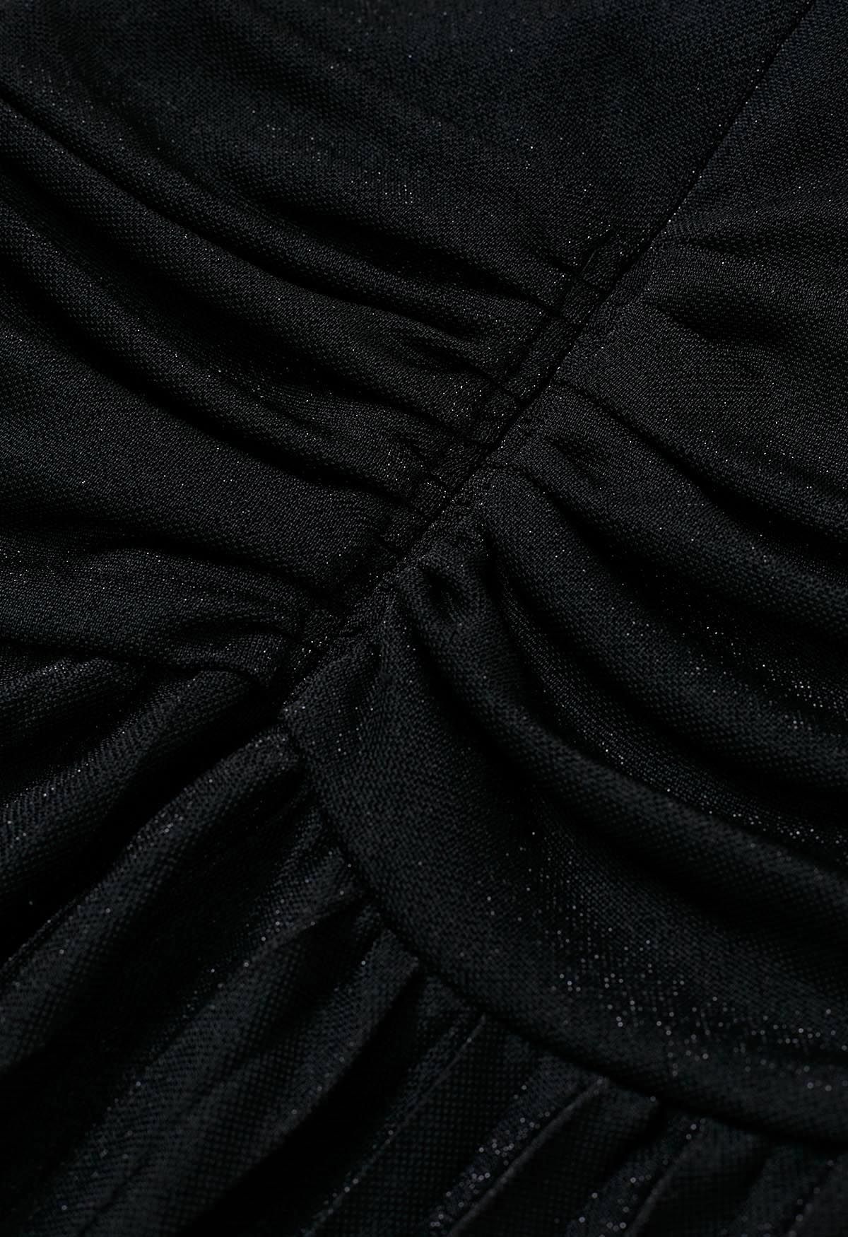 Robe longue plissée scintillante à devant torsadé en noir