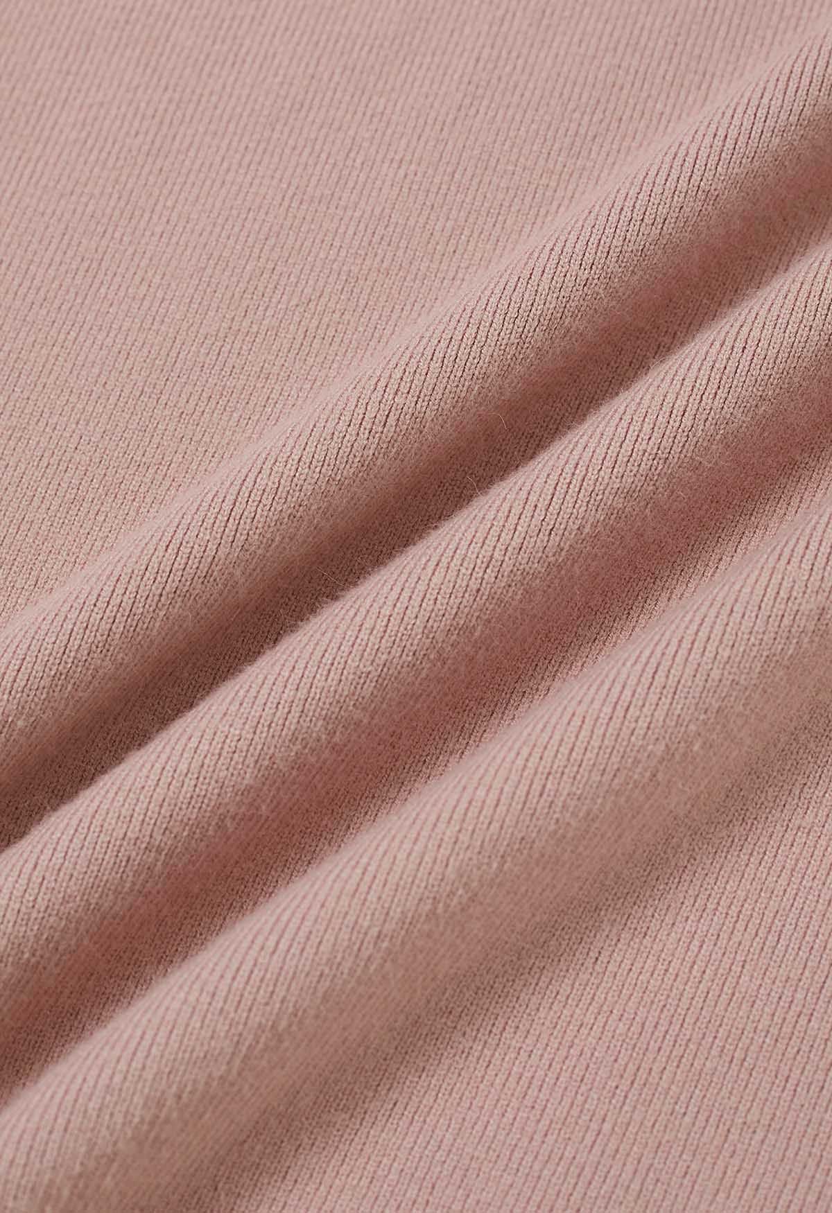 Haut en tricot à col roulé et manches gigot en rose poudré