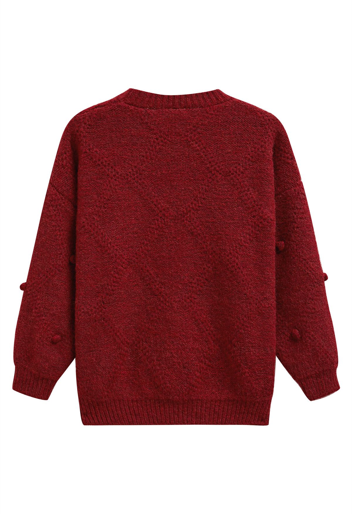 Pull en tricot à pompons en diamant en rouge