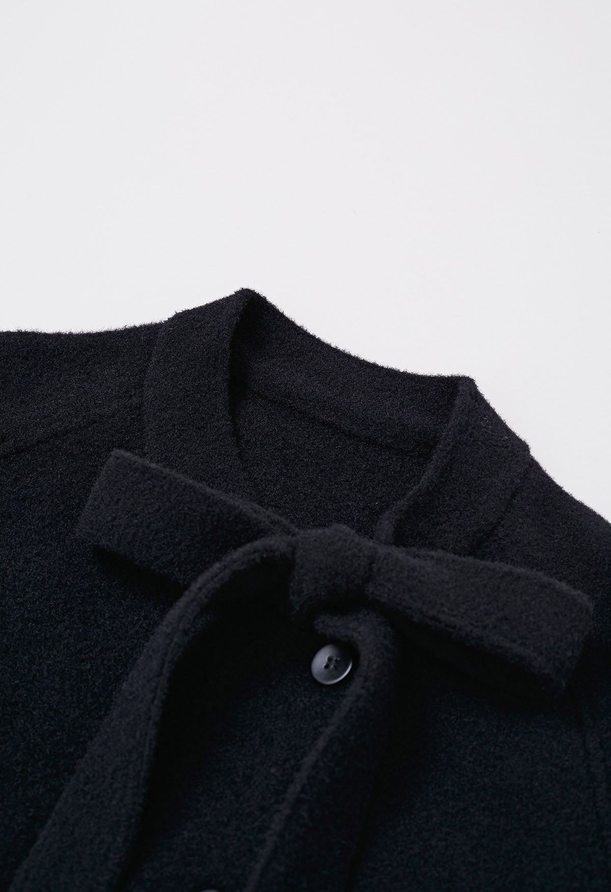 Joli manteau boutonné en tricot avec fausse fourrure et nœud papillon en noir