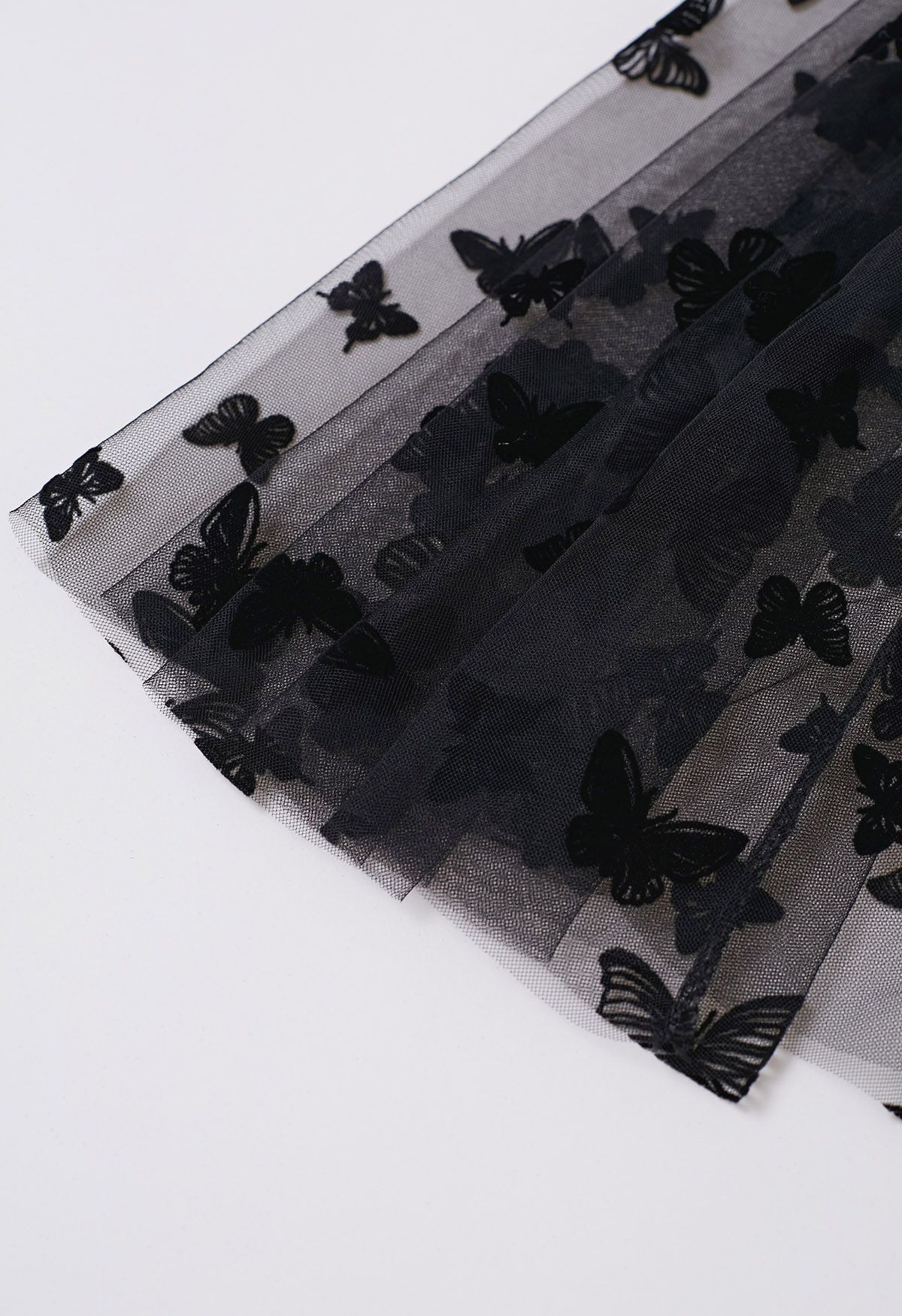 Jupe mi-longue en tulle à motif papillon valsé en noir