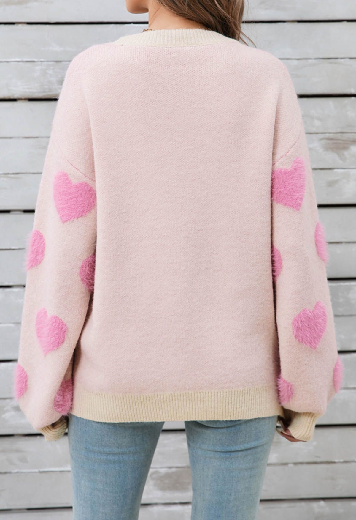 Pull ras du cou en tricot contrasté à motif cœur flou en rose clair