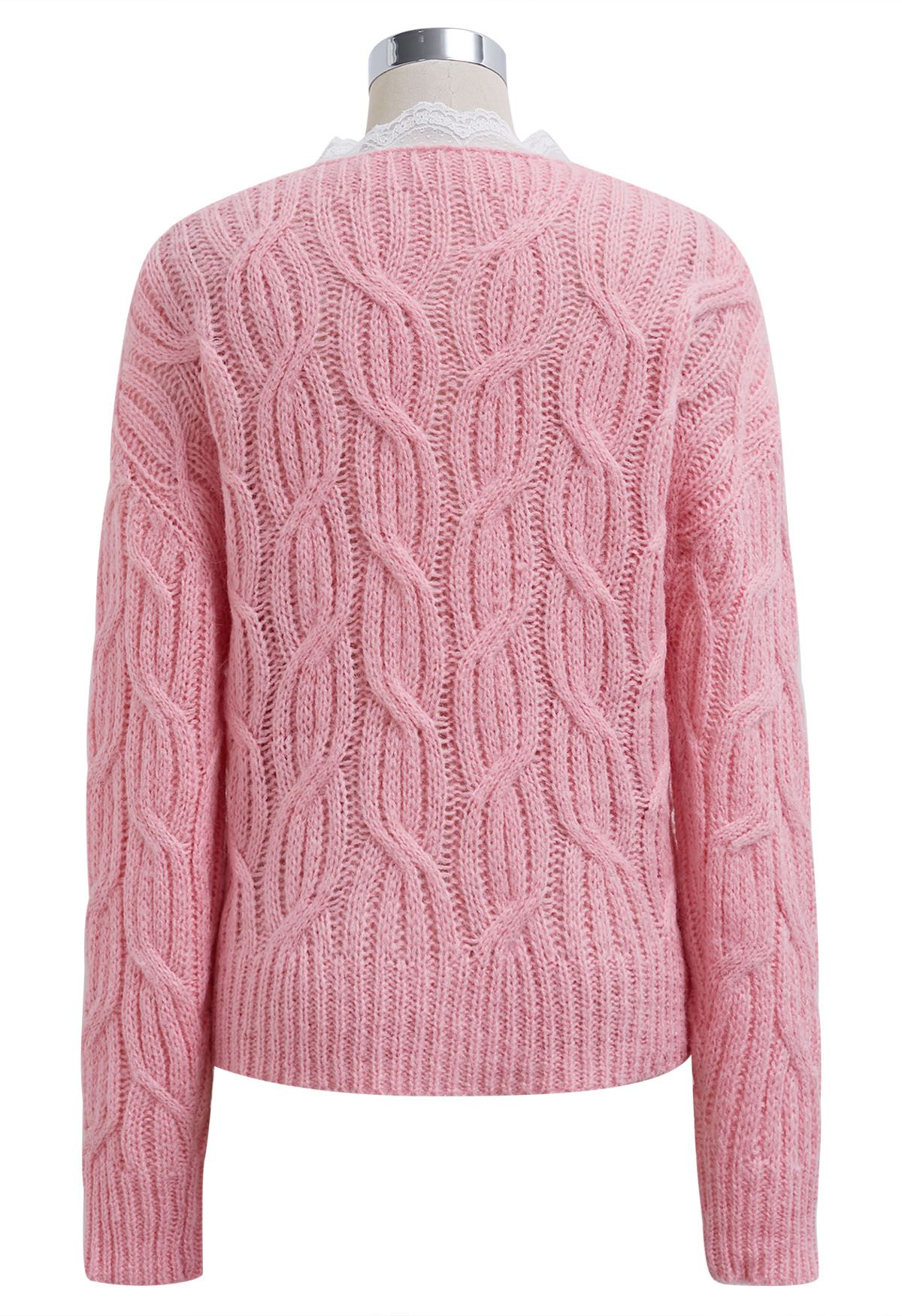 Pull en maille torsadée croisée avec bordure en dentelle en rose