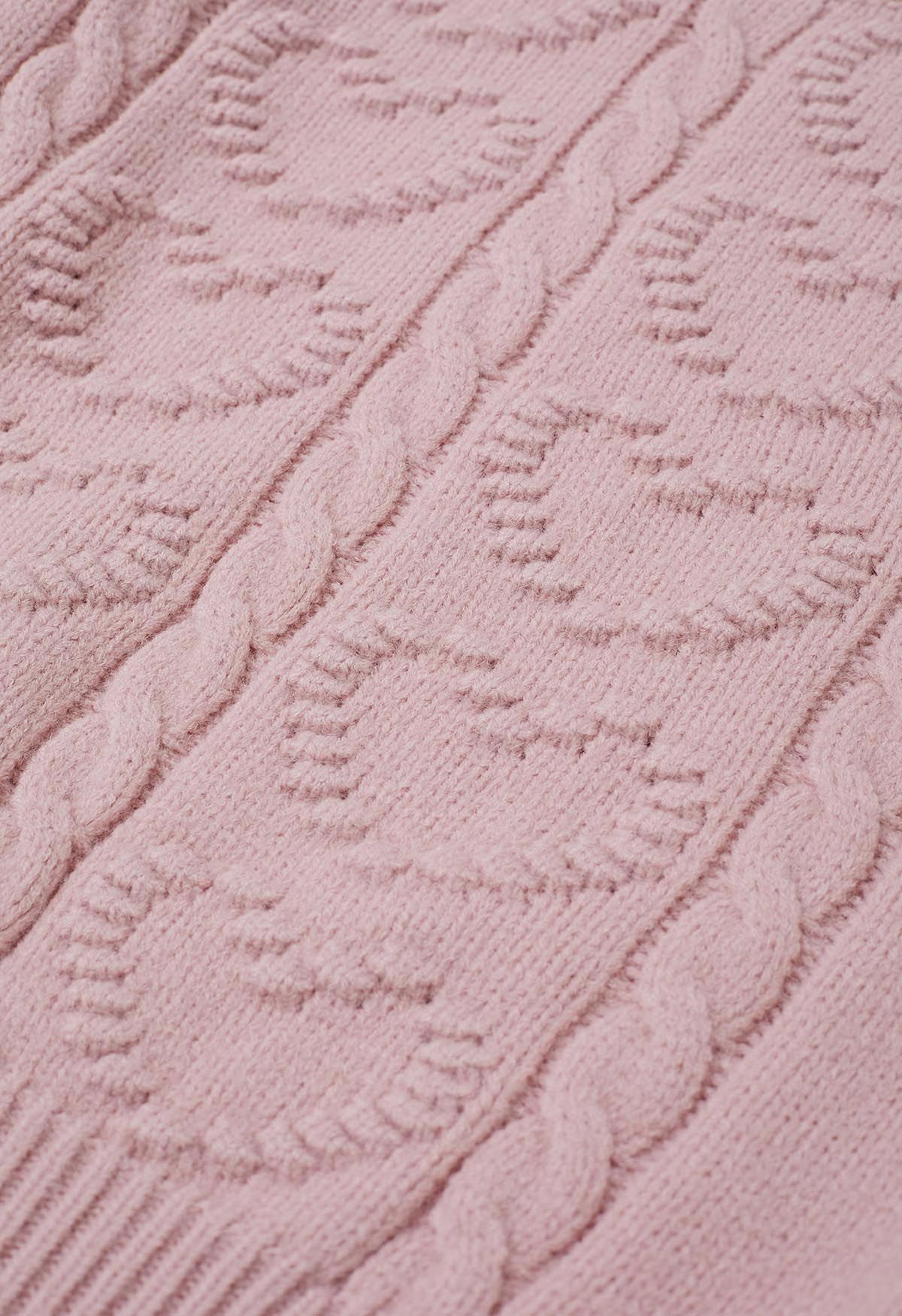 Pull en maille torsadée avec motif cœur en relief en rose clair