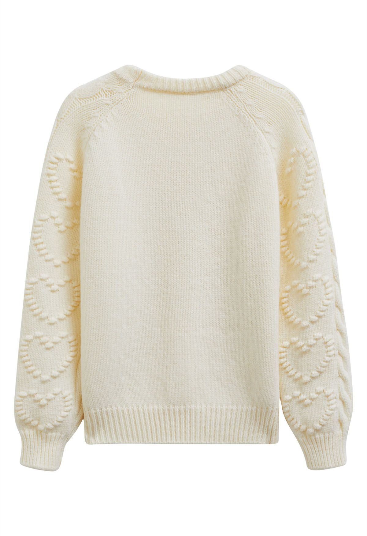 Pull en maille torsadée avec motif cœur en relief en crème