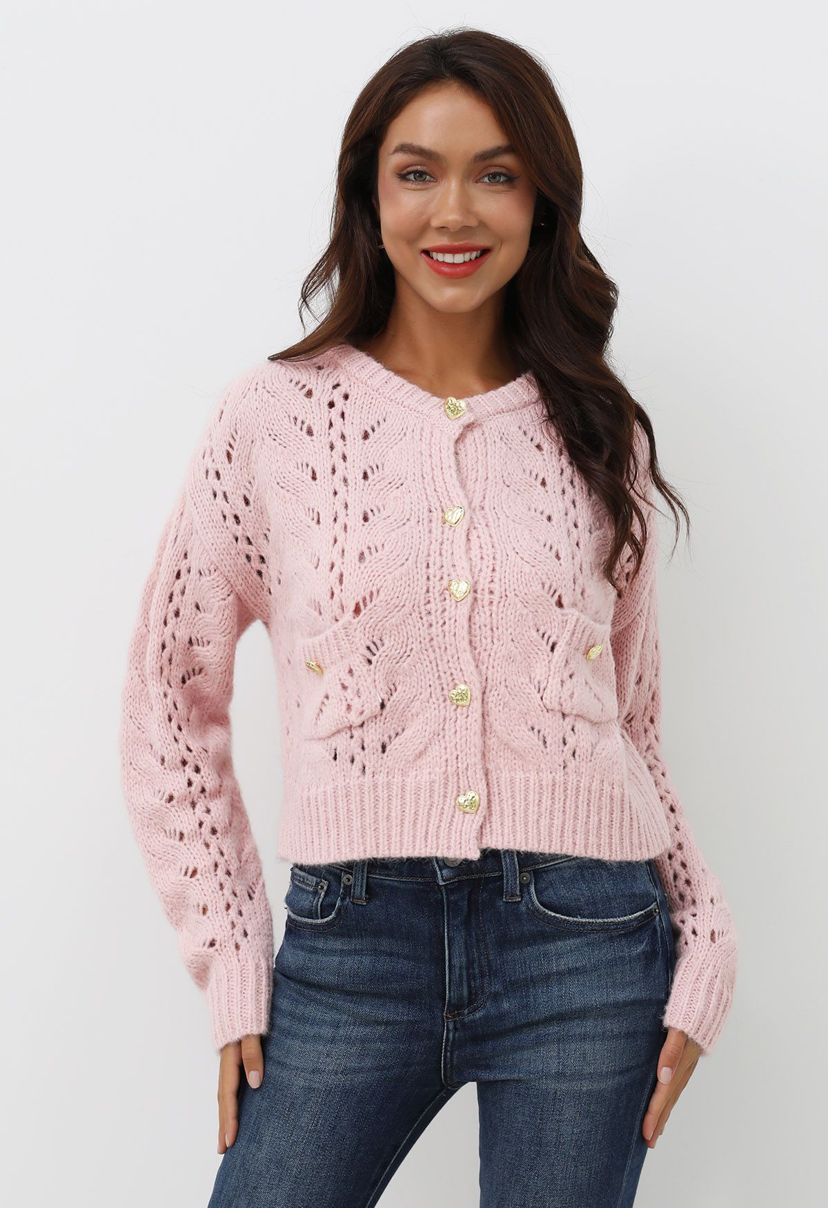 Cardigan court en maille ajourée à boutons en forme de cœur en rose